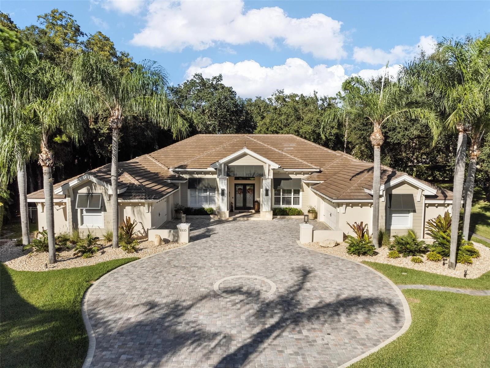 Don’t miss this magnificent Model Perfect property that has been updated to true custom builder standards. Architect-designed renovation with no expense spared. The seller has invested Hundreds of thousands of dollars in improvements starting with the exterior. New Tile Roof, Facia, Soffit, Lap Siding, New Stucco, New Exterior paint, and new brick pavers on the majestic driveway. Enjoy the privacy and solitude of this beautiful home nestled in the trees at the far end of the cul-de-sac. New large Fenced dog run, Exterior lighted to accent the new landscape package throughout the property. This 4 bedroom, 4 bath home with office and bonus room is a perfect combination of elegance and comfort. Entertain formally in living and dining rooms with a wall of sliders opening to the lanai and the expansive, private pool deck finished with new Travertine Decking surrounding the remodeled pool and spa package with new filter/Valve System, heater, LED Lighting & new Outdoor Kitchen/Bar with Block construction & Granite top. The pool cage was painted & re-screened. Large gourmet kitchen with New High-End Granite countertops, New High-End wood cabinets, stainless appliances, and a gas cooktop. 
 
The master bathroom is fully remodeled, walk-in marble shower, new stone tub, vessel sinks, High-End plumbing fixtures, Lighted Mirrors, new lighting fixtures, and new Tile floors. Relax in the soaking tub with a window atrium. The master bedroom features a sitting area and pool access.
 
Three additional bedrooms are in a split plan. Endless possibilities for the huge bonus room. Currently used as a game room, it could be a 5th bedroom, exercise, or theater room. Designer lighting, custom draperies, a wine bar, and second bar, all-new cabinetry, and a beautiful laundry room finish the look.

Four garage spaces in two separate garages, one air-conditioned, both with New Hurricane Rated Garage doors and Epoxy floors. 2 New 5-ton A/C Units with Smart Thermostats.
 
Location! Live on a quiet street in the exclusive gated subdivision of Muirfield in Eastlake Woodlands. Eastlake Woodlands is a golf and tennis community with two renowned golf courses and a newly renovated premier clubhouse. Membership is required to enjoy golf, tennis, swimming pools, a child activity center, and a gym. Eastlake Woodlands is central to all dining, shopping, and highly-rated schools. A short drive will take you to all area beaches, activities, and Tampa International Airport. For more pictures, be sure to watch the virtual tour with drone photography.