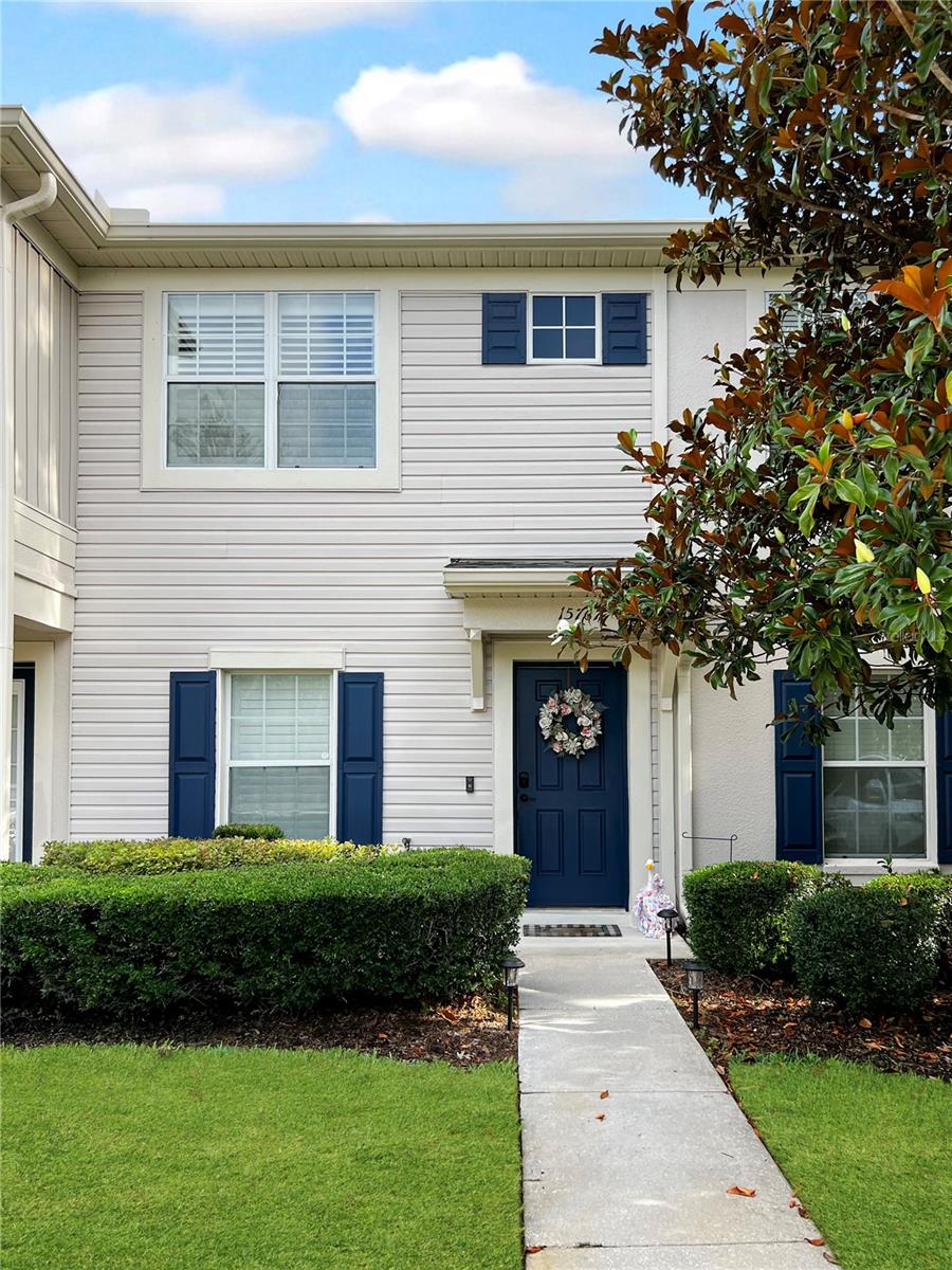Welcome to this 2 bed, 2.5 bath townhome in the highly sought after Lone Star Ranch community, this beautifully maintained townhome offers stylish, low maintenance living in a gated neighborhood. Inside, you’ll find luxury vinyl plank flooring throughout, plantation shutters on every window, and an open layout connecting the living and dining areas. The kitchen features newer appliances, a closet pantry, ample storage, and a convenient half bath nearby.  Sliding glass doors lead to an extended screened-in patio overlooking a peaceful retention pond. There is a large storage room off the patio as well.  Upstairs, the spacious primary bedroom has dual closets and an en-suite bathroom.  The guest bedroom has a walk in closet and its own bathroom as well.  The building just had the roof replaced in 2025.  This home also has an assumable mortgage of 2.9%.  Located just steps way is the community pool offering cabana style relaxation in the sun.  This property is ideally located just off the Suncoast Parkway for easy access to Tampa airport, shopping, dining, and the beaches.  This home truly has it all, schedule your showing today.