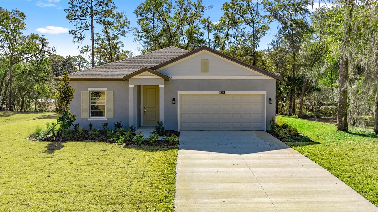 This new home design combines modern comfort and low-maintenance living on a convenient, single-floor layout. Off the entry is a flex space ideal for versatile needs, while further down the hallway is the open-concept main living area with a covered rear porch. On the opposite side of the home are two secondary bedrooms and a serene owner’s suite complete with an attached bathroom and walk-in closet.