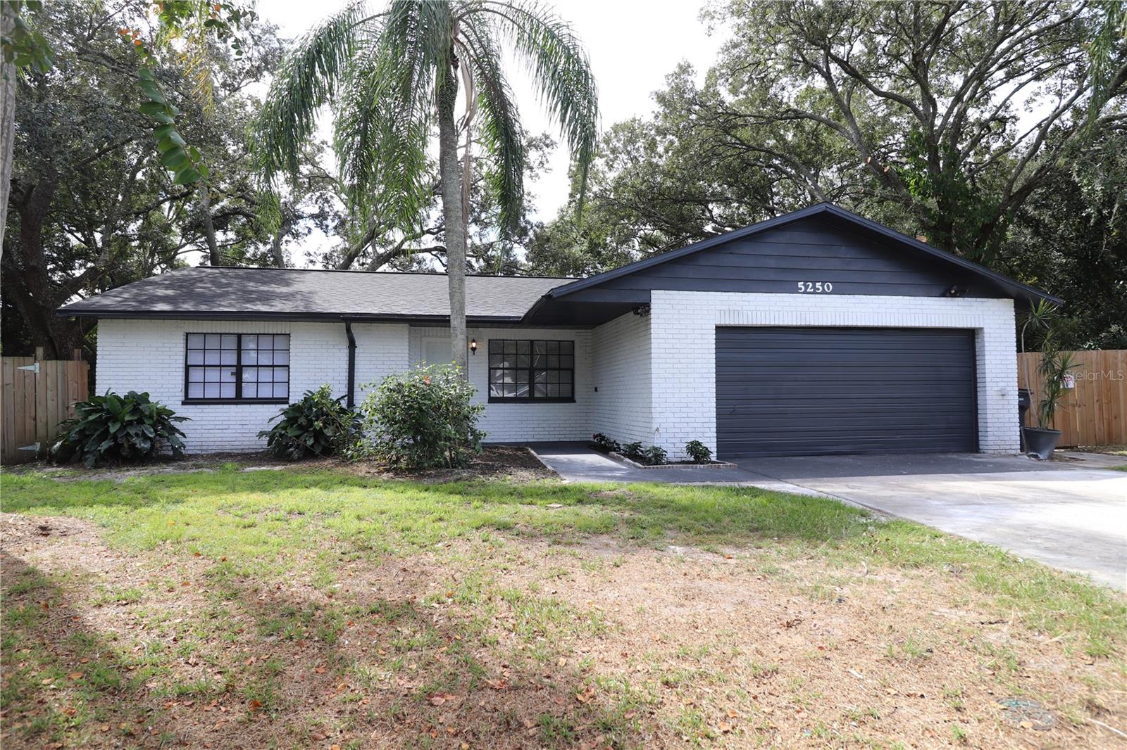 Located in a quiet cul-de-sac, this fully remodeled 3/2 home offers the perfect blend of modern luxury and tropical charm. The open-concept living space is flooded with natural light, creating a warm and inviting atmosphere. The heart of the home is in this spacious kitchen, which has been thoughtfully updated with sleek granite countertops, stainless steel appliances, and custom cabinetry. The master bedroom features a generous walk-in closet for all your storage needs. One of the standout features of this home is the screened back porch. This outdoor space is perfect for hosting barbecues, sipping your morning coffee, or unwinding with a good book. Don't miss this opportunity to make this fully remodeled Florida gem your forever home. Schedule your private showing today and start living the Florida dream! **Special program with seller's preferred Lender now has down payment assistance and contribution towards closing costs.**