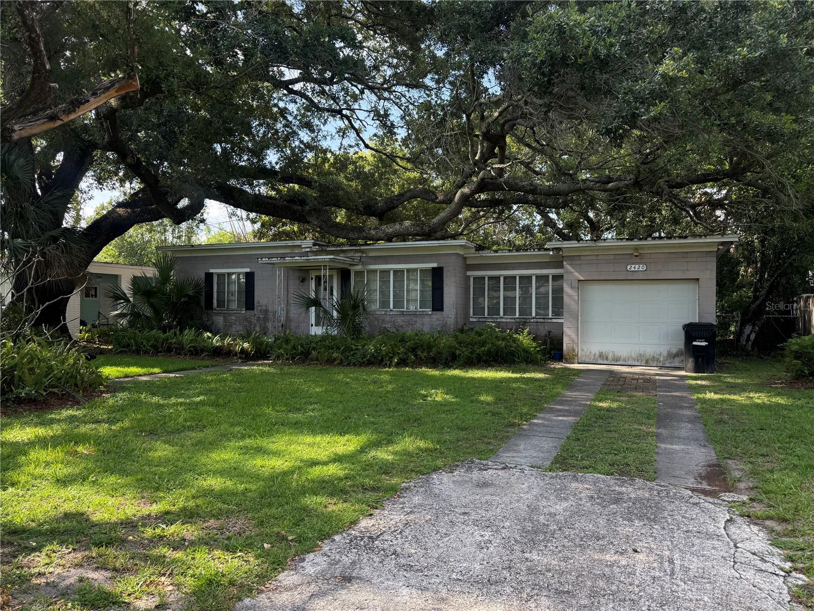 Virtually Staged. Meet Miss Colonialtown, a charming 1953 residence offering original character, an exceptional location, and tremendous renovation potential. A rare opportunity to create something truly special in Orlando’s highly desirable Colonialtown area. Built in 1953, this one-story home offers 4 bedrooms, 2 bathrooms, and sits on a generous 8,278-square-foot lot.

This home is a true fixer-upper with incredible potential for a buyer who appreciates character and is ready to bring a vision to life. Original wood flooring runs throughout the home, while the living and dining rooms feature distinctive wood ceilings that add warmth, charm, and architectural personality rarely found in newer construction.

With the right love, attention, and thoughtful updates, this property could become a stunning residence that blends its original mid-century character with modern comfort and design.

The location is one of the home’s greatest advantages. Colonialtown is known for its established neighborhoods, convenient access, and proximity to shopping, dining, area schools, Downtown Orlando, the Milk District, and I-4. Whether you are an owner-occupant looking to customize a home or an investor searching for a promising renovation opportunity, this property offers location, character, and exciting possibilities.

Bring your vision, schedule a private showing, and discover whether Miss Colonialtown is the opportunity you have been waiting for.