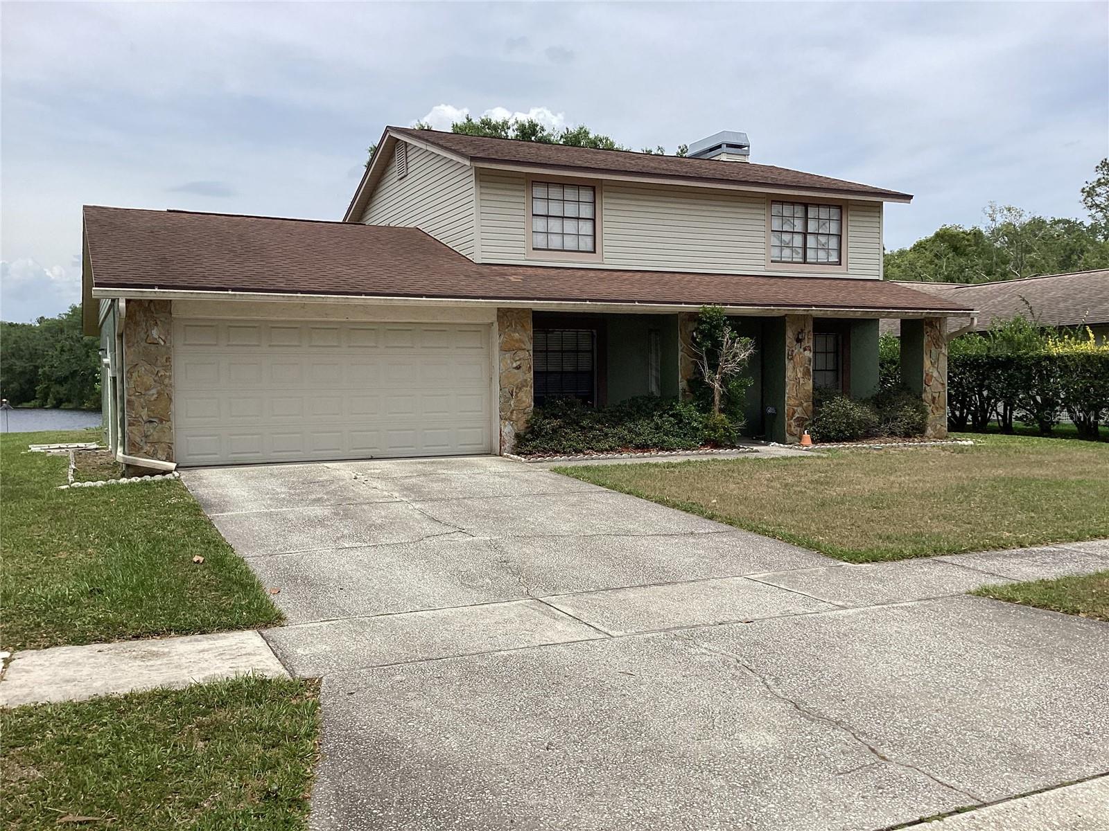 Investor special, this home needs some work. Some indication of deferred maintenance in some areas. It is a perfect floor plan and location for a growing family when the repairs are complete.  First floor has an open floor plan, with a woodburning fire place and french doors  view of the lake.  The galley kitchen is very nice and features most appliances. There is also a half bath near the kitchen with acess to the back yard, or maybe a pool some day. The laundry room is nestled near the powder bath. All the bedrooms are upstairs as well as two full baths. Truly a vision of a perfect two story traditional home. Homeowners Association fees are low and cover ground maintenance, basketball courts, recreation facilities, tennis courts,playground and a park! all for a fee of $175 a year!