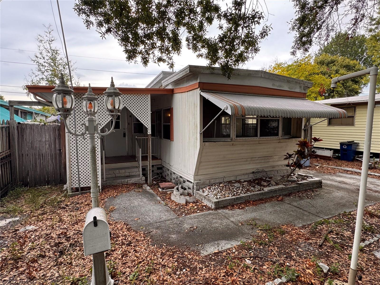 Opportunity awaits with this 2-bedroom, 1-bath mobile home situated on its own lot in an established area of Pinellas County. Whether you're an investor, handyman, or buyer looking for an affordable property to renovate, this home offers tremendous potential.

The property is being sold strictly As-Is and will require repairs and updating, making it ideal for cash buyers looking to add value. Inside, you'll find a functional floor plan with a spacious living area, eat-in kitchen, and covered front porch ready to be transformed into a comfortable residence or investment property.

One of the property's greatest advantages is that you own the land—there are no monthly lot rent fees and no HOA restrictions, providing flexibility and long-term value that is increasingly difficult to find.

Conveniently located near shopping, restaurants, parks, medical facilities, downtown St. Petersburg, and the Gulf beaches, this property offers an excellent location with easy access to everything Pinellas County has to offer.

If you're looking for your next renovation project or investment opportunity, this property is one you won't want to miss. Cash offers only.