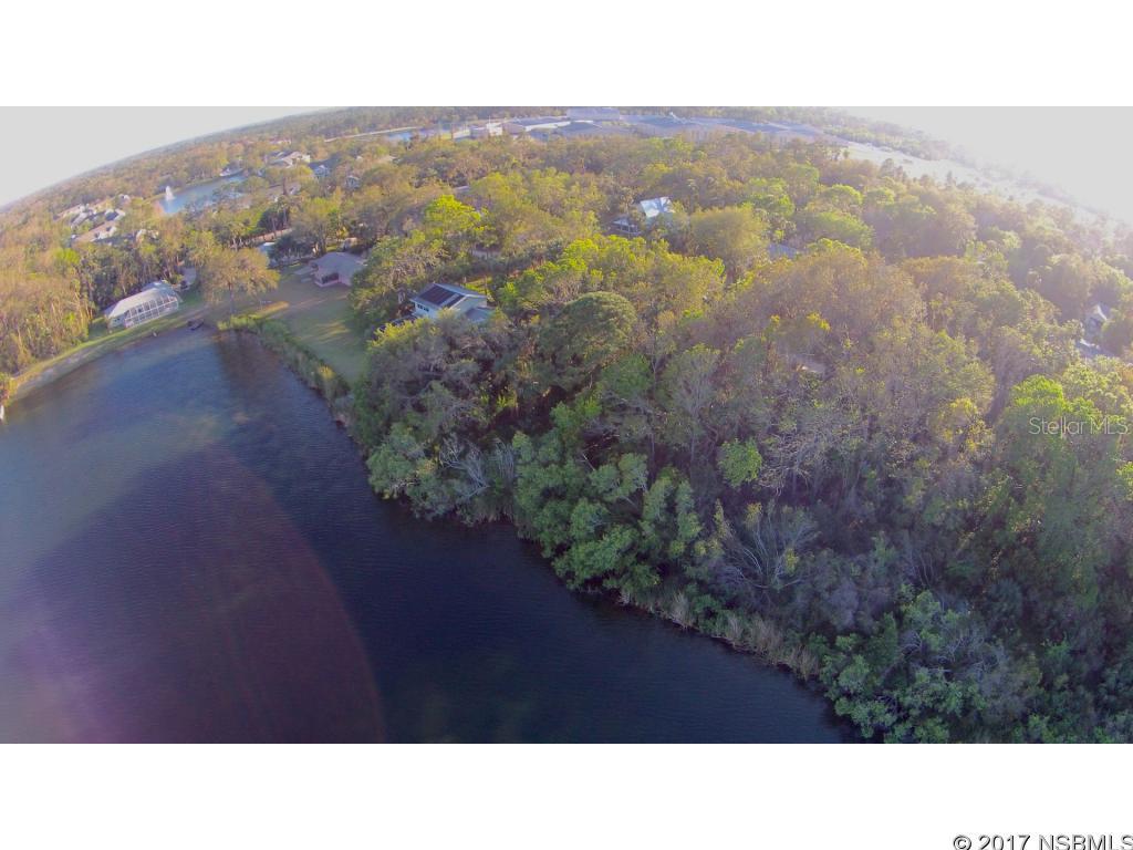 Build your dream waterfront home. With captivating views of a very large lake centrally located in beautiful New Smyrna Beach. There are 3 lots currently available, each being sold separately. Or you may offer to purchase all 3 until one sells. So do not miss this rare opportunity. All information is intended to be accurate but is not guaranteed.; Cleared: No ;Water: Available at Site