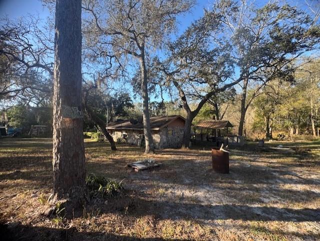 Seller is MOTIVATED and Ready to Negotiate! Price Improvement in Place! Enjoy country living with the convenience of town nearby! This fixer-upper sits on a corner lot that is over 1/4 acre of cleared land with beautiful mature trees. The property includes a single-family home with a basement.  This home is a fixer-upper, roof repair and seawall repair to the basement is in need of repair.  Equipped with a private well and septic, this property is ideally located near the Withlacoochee State Forest, perfect for nature lovers and outdoor enthusiasts. Convenient access to Hwy 50/Cortez Blvd, Hwy 301, I-75, and the Florida Turnpike makes commuting easy.  You’re just minutes from shopping, dining, community events, and the popular Webster Flea Market, and centrally located between Tampa and Orlando. Plus, enjoy being within 45 minutes to an hour of Florida’s beautiful beaches and natural springs. A great opportunity for those seeking space, location, and potential! This property is currently tenant occupied.  The opportunity to keep it an income property with a seasoned tenant. The possibilities for this property are endless. This Owner has additional properties that are available and will consider selling all together for one price. All properties are income rental properties.