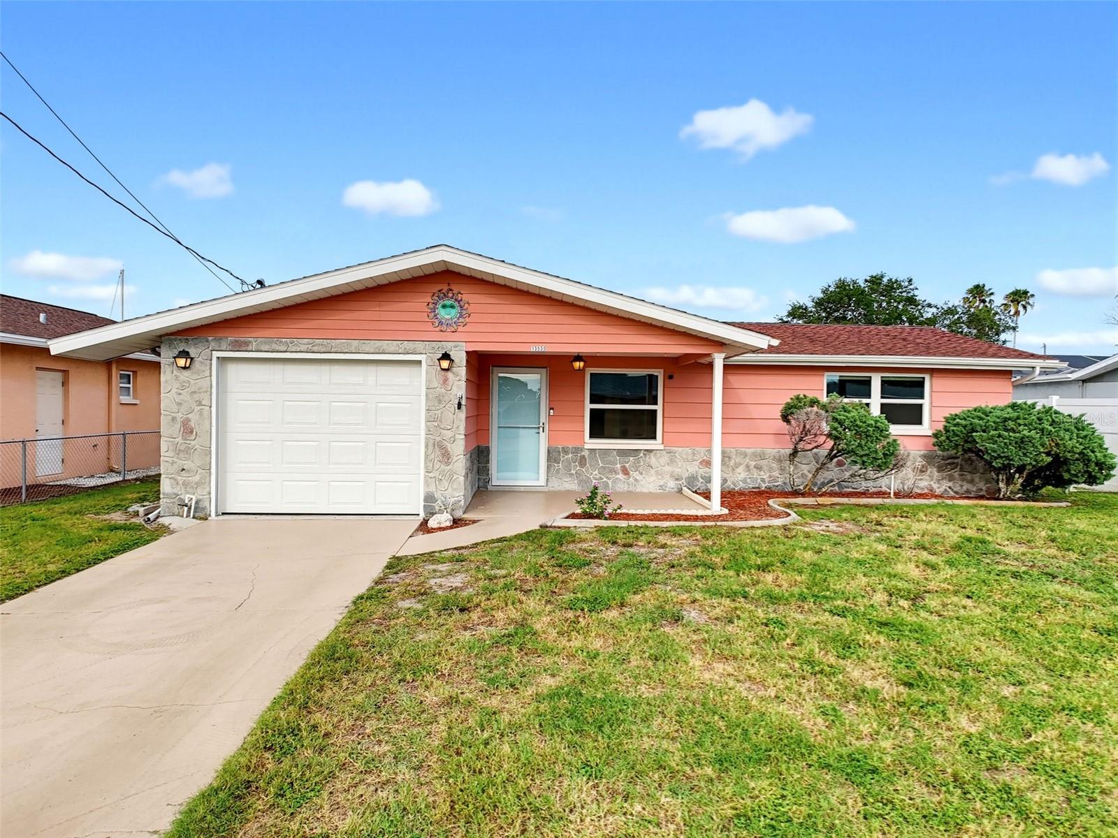 This charming home is in the desirable SEA RANCH ON THE GULF SUBDIVISION featuring 2 BEDROOMS, 1.5 BATHS, KITCHEN, LIVING ROOM, DINING ROOM, and SUNROOM all with TERRAZO FLOORS. The LARGE SCREENED IN LANAI brings you out to the 60ft of CONCRETE SEAWALL with an 8 X 12ft FLOATING DOCK and very easy access to the OPEN GULF. UPDATES include AC, HURRICANE WINDIOWS and DOORS, ELECTRIC, ELECTRIC PANEL, SHEETROCK, PAINT and STUCCO. All your local restaurants like Inn on the Gulf, Sam's Beach Bar and Get Hooked are a 5-minute drive. Sunwest Park is a local waterfront attraction that is nearby as well. The Bayonet Point Hospital, many local supermarkets and the Port Hudson Marina are all located right here in Hudson, Florida. The Tampa Bay Airport, Tampa Bay, Clearwater Beach, Homosassa Springs, Tarpon Springs, Pine Island, Honeymoon Island and Weeki Wachee are all under an hour away. Fish & crab off your own dock or take a kayak, jet ski or boat ride to the open Gulf where the fish are plentiful, the fun is never ending and the sunsets are always awesome!
