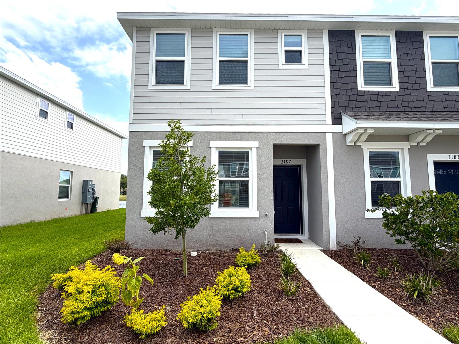 Almost-new end-unit townhome located in the desirable Westview community of Poinciana! This beautifully maintained two-story home features an open-concept floor plan with a spacious living and dining area that flows seamlessly into the modern kitchen—perfect for everyday living and entertaining. Sliding glass doors lead to a covered lanai overlooking a tranquil pond, providing a peaceful outdoor retreat. The first floor also includes a convenient half bath, a generous pantry, and additional storage space. Upstairs, you'll find two spacious primary suites, each with its own private full bathroom. One suite features an oversized built-in closet spanning the length of the room, while the other offers a large walk-in closet. A full-size washer and dryer are conveniently located on the second floor.
Residents of Westview enjoy resort-style amenities, including a community pool, clubhouse, dog park, playground, and sports fields. Ideally located near Highway 17 and State Road 538 (Poinciana Parkway), this home offers easy access to Orlando, area attractions, shopping, dining, and major employment centers.