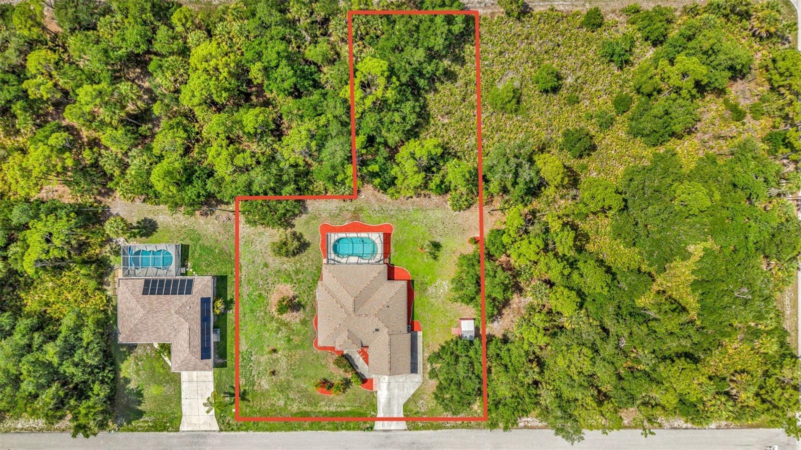 3 LOTS + WORKSHOP + SHED + POOL! Bring all your tools, toys, boat, and RV with plenty of room to spread out. Located on a quiet street in Port Charlotte, NO HOA or Deed Restrictions. Spacious screened entry leads to double front door and an open floor plan with 3 bedrooms + Den. Entry into the living room with high ceilings that open to the lanai / pool through sliding glass doors and bonus room / office / den with double pocket doors makes the space versatile and private. Split bedroom plan with guest bathroom and bedrooms separated from living areas by a pocket door. Primary suite features new carpet and a spacious walk in closet. Perfect for a handyman or a hobbyist with a workshop in the garage or can be removed to have extra space in the garage. Cathedral ceilings, recessed lighting, newer ceiling fans, hurricane shutters, baby barrier pool fence, inside laundry room, and shed for storage. One Owner Home has been well maintained with a New Roof 2023, WH 2025, AC 2018, RePipe 2012. Located in the heart of Port Charlotte, close to hospitals, shopping and I-75. Come live your best life in SW FL and take advantage of all the Sunshine State has to offer with World Famous Fishing, Nature parks, Award-winning Golf Courses, and stunning beaches on the Gulf of Mexico! Conveniently located near I-75, a quick 30-minute drive to Sarasota or Fort Myers, Charlotte County is home to the beautiful historic downtown Punta Gorda, Hilton Curio Sunseeker Resort, and the Atlanta Braves and Tampa Bay Rays Spring Training Sports Parks! Don’t miss your opportunity to make this wonderful town YOUR hometown! *See Tour 1 for Virtual Walk Through* LOW Flood Insurance - $2610