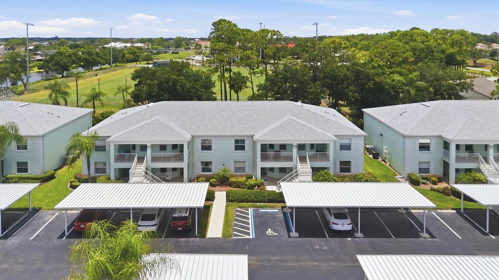 TURNKEY FURNISHED COCOPLUM CONDO – MOVE-IN READY! Beautifully maintained second-floor 2BR/2BA condo in the sought-after 55+ Cocoplum Condo Community offering comfortable Florida living, tasteful updates, and exceptional value. This coastal-inspired home features soaring VAULTED CEILINGS, tile and ENGINEERED WOOD flooring throughout (no carpet), an UPDATED KITCHEN with GRANITE countertops, IMPACT-RESISTANT WINDOWS, an UPGRADED ELECTRICAL PANEL, updated lighting, ceiling fans, and plumbing fixtures, plus the convenience of an in-unit stackable washer and dryer. The split-bedroom floor plan provides privacy, while the spacious living and dining areas open to a screened, tiled lanai with peaceful preserve views, & VERSATILE DOUBLE SET sliding glass doors, —perfect for enjoying your morning coffee or relaxing year-round. The primary suite features a walk-in closet and private bath, while the guest bedroom and guest bath provide comfortable accommodations for family and friends. Plantation shutters throughout add timeless style. Recent community improvements include a NEW ROOF, and low monthly condo fees cover city water, sewer, and pest control. An assigned covered carport is included, and one small pet (up to 15 lbs.) is welcome. Enjoy the community pool and a carefree Florida lifestyle just minutes from Cocoplum Village Shops, restaurants, public transportation, COSTCO, WELLEN PARK, the Atlanta Braves Spring Training stadium, Myakkahatchee Creek Environmental Park and walking trails, Heron Creek Golf & Country Club with public play, and the new $507 million Sarasota Memorial Hospital campus currently under construction. With NO CDD fees, affordable condo fees, and exceptional value at this price point, this is your opportunity to invest less, enjoy more, and own your own slice of paradise!