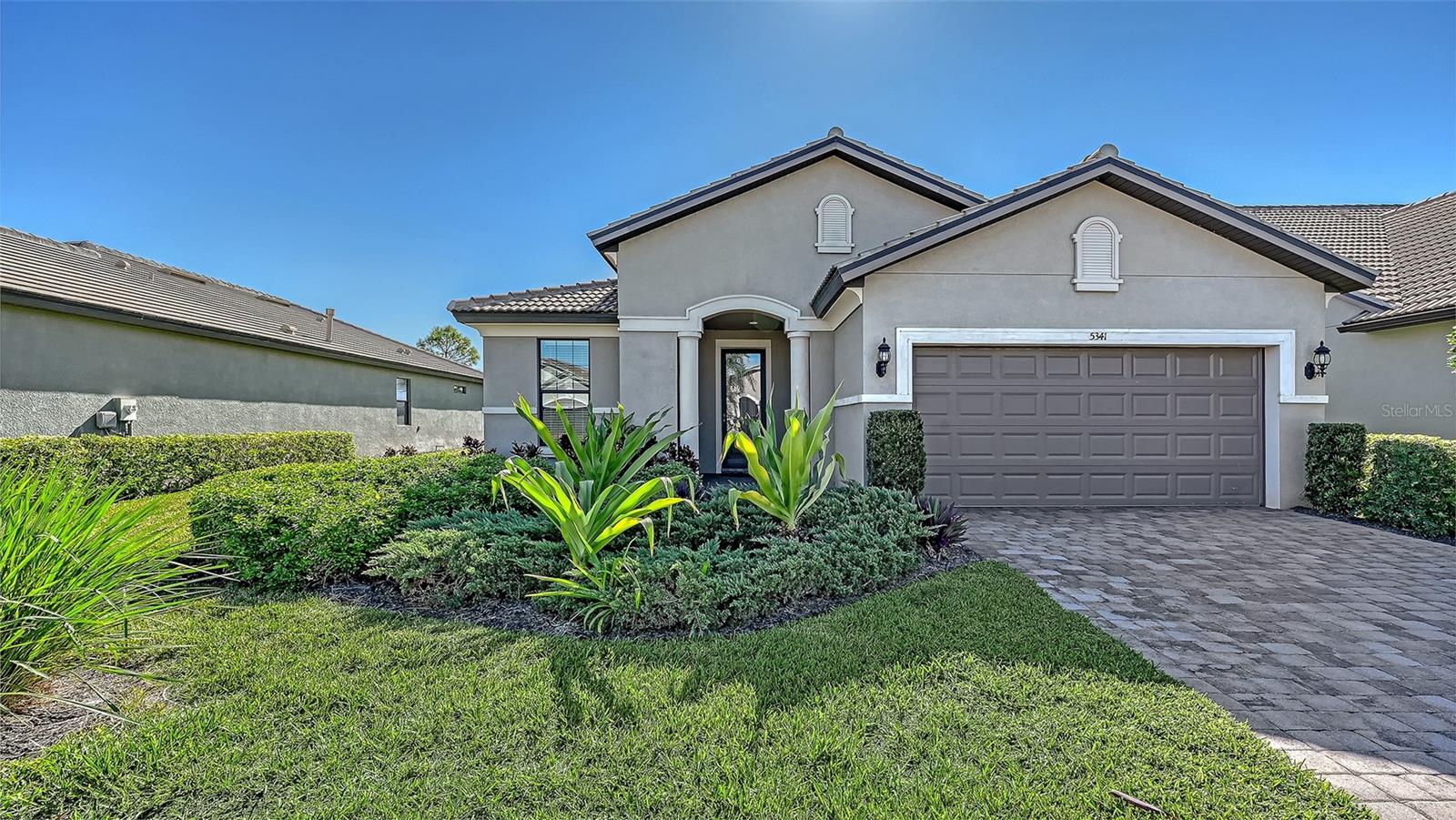 Exceptional value in popular Sandhill Preserve on Palmer Ranch. Martin Ray floorplan free villa with lake views. This beautiful home features 3 bedrooms plus a den/office, 2 full baths. All hurricane impact doors & windows (low insurance costs). Gourmet kitchen with wood cabinets, granite counters, upgraded stainless appliances with large walk-in pantry. Main living area is tiled with all bedrooms featuring wood look floors. Extended lanai overlooking long lake views. Room to add a private pool.   Sandhill Preserve is one of Palmer Ranch's newer communities with only 308 homes* The community features a community pool, jacuzzi, fitness center, pickle ball, club house, fire pit, barefoot bar area tennis & more. Located in the heart of Palmer Ranch just minutes from world famous Siesta Key beach, shopping, restaurants & Legacy bike trail*