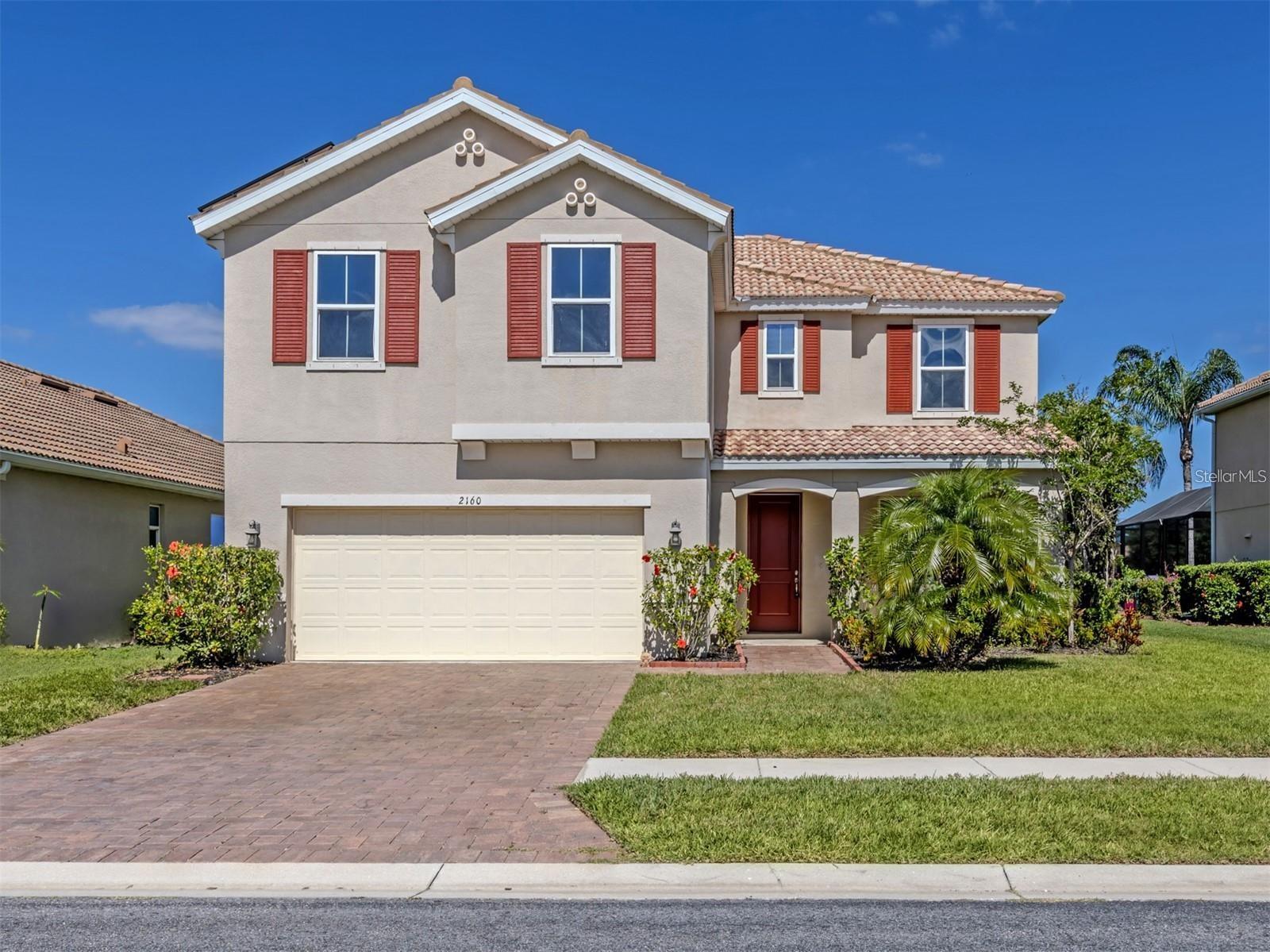 Virtually Staged. Virtually Staged. Falling in love is easy with this gorgeous, two-story, 2,604-sq.-ft. home located in the highly sought-after, gated community of Stoneybrook at Venice. Step through the front door into an inviting, open-concept floor plan that instantly draws your eyes to serene lake views. Flowing seamlessly from the living room—which easily accommodates a large sectional—is a screened lanai complete with a private hot tub, offering the perfect oasis to unwind and enjoy Florida’s spectacular western sunsets. The main level is designed for effortless living and entertaining, featuring a versatile den and a spacious kitchen equipped with rich granite countertops, a pantry, and a large island with bar seating. The kitchen boasts brand-new stainless-steel appliances installed in 2025 (refrigerator, built-in microwave, and dishwasher) along with a 2019 range. For ultimate convenience, a half-bath is situated just off the kitchen near the garage entrance. Upstairs, a large landing offers an excellent multipurpose space for a media room, play area, or home office, all fitted with upgraded carpeting installed in 2023. The expansive primary suite serves as a true retreat, accessed via elegant French doors. It features panoramic views of the backyard and lake, a generous walk-in closet, and a luxurious en-suite bathroom with double granite vanities and a walk-in shower. Three additional, well-appointed guest bedrooms share the upper level, alongside a full guest bathroom with a tub/shower combo and double granite sinks, and a dedicated laundry room. This home is also eco-friendly, equipped with solar panels installed in 2023 for maximum energy savings. Please note that the current property taxes include the solar panel assessment, which will be fully paid off and remedied at closing, significantly lowering future taxes for the buyer while the panels remain. Move-in ready updates from 2025 include a fully painted interior, fresh sod in the front yard, and a newly sealed paver driveway. Located in a premier gated community with easy access to I-75, Stoneybrook at Venice offers resort-style amenities including a community pool, splash pad, clubhouse, pickleball, tennis, basketball, volleyball courts, and playgrounds. Your spacious Florida dream home awaits!
