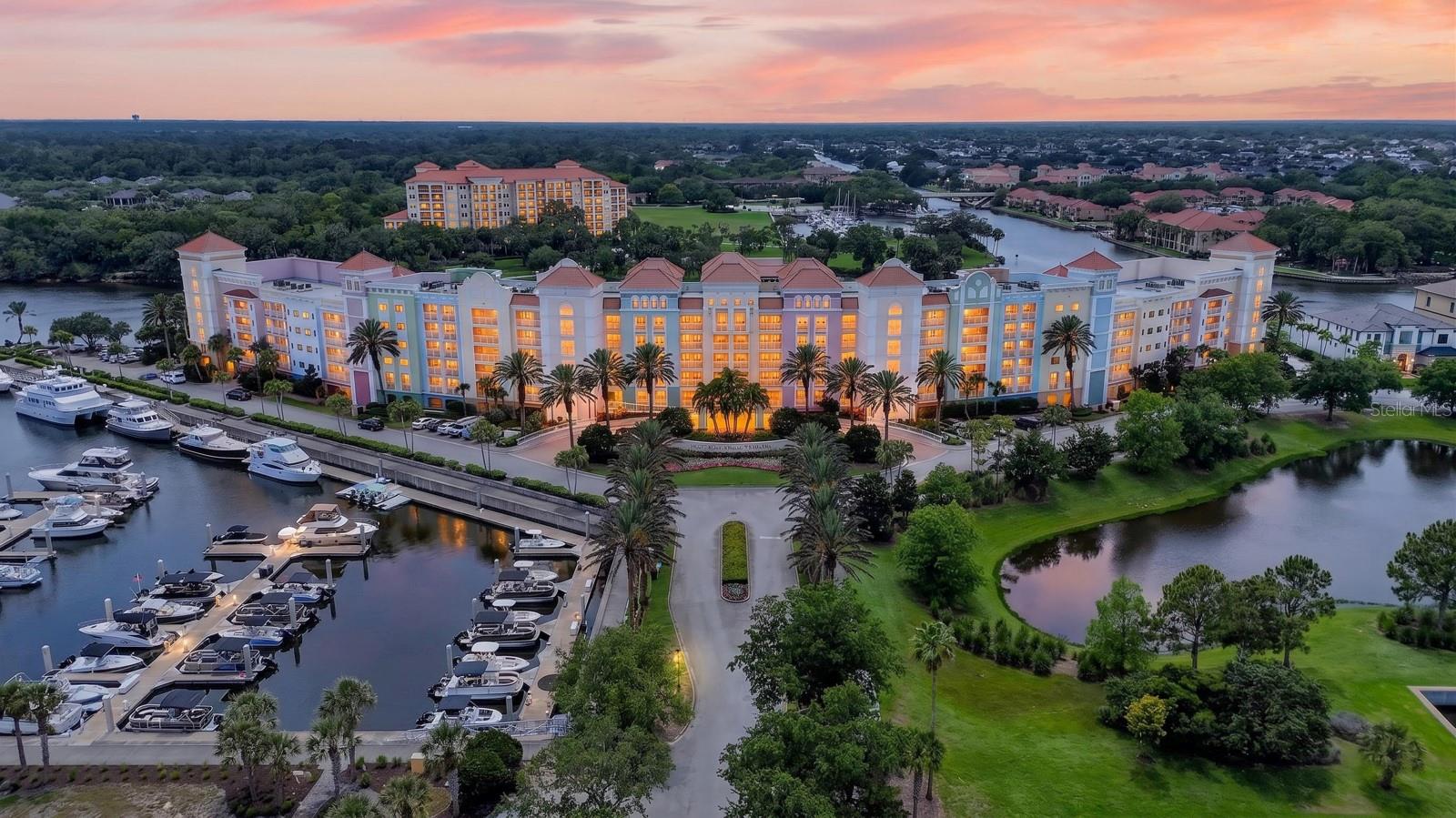 One or more photo(s) has been virtually staged. Experience luxury coastal living in Yacht Harbor Village, perfectly situated between the Atlantic Ocean and the Intracoastal Waterway in the highly sought-after Hammock area of Palm Coast. This beautifully maintained 2-bedroom, 2-bath condo offers the ideal blend of waterfront tranquility, resort-style amenities, and investment potential. The open-concept floor plan features spacious living and dining areas, a well-appointed kitchen, and a private balcony showcasing some of the most breathtaking sunset views in the community — the perfect setting to unwind and enjoy Florida’s coastal beauty each evening.

The generous primary suite offers balcony access, a walk-in closet, and an en-suite bath with dual vanities and a soaking tub, creating the perfect private retreat. Whether you are seeking a primary residence, vacation getaway, or income-producing property, this condo delivers the ultimate Florida lifestyle.

Yacht Harbor Village offers an exceptional marina lifestyle with boat slip rentals available for owners, along with on-site boat and jet ski rentals for endless days on the water. Residents and guests enjoy a waterfront pool, fitness center, walking and biking trails, tennis courts, and direct access to the Intracoastal Waterway.

Short-term rentals are permitted, making this an outstanding opportunity for investors or seasonal owners. Optional membership opportunities to the exclusive Hammock Beach Golf Resort & Spa is available, providing access to a vibrant social atmosphere and world-class resort amenities including numerous oceanfront pools, championship golf courses, waterfront dining, tennis, spa services, fitness facilities, and private beach access. Live where every day feels like a vacation in one of the Hammock's premier waterfront communities.