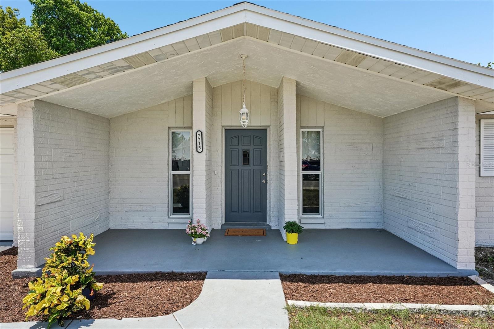Charming block home in the established Embassy Hills community of Port Richey - this is the one you've been waiting for! The curb appeal alone will stop you in your tracks, with fresh neutral paint, a welcoming covered front porch, and beautifully landscaped grounds that set the tone the moment you pull up.

Inside, the open living and dining area feels bright and airy, with laminate flooring flowing through the main living space and natural light pouring in from multiple windows. The kitchen offers white cabinetry and stainless steel appliances, keeping things clean and functional. The layout is smart - two well-sized bedrooms, two full baths, and a bonus family room that gives you the flexibility to spread out, work from home, or host guests. The Florida room is the true hidden gem of this home - a sun-drenched enclosed space with sliding glass doors that connects your living area directly to your fenced backyard, creating that seamless indoor-outdoor Florida lifestyle buyers love. The private, fenced backyard gives you your own space to relax, garden, or entertain under the open sky.

On a quiet street in a well-established neighborhood, this is the kind of home that feels like a fresh start - low-maintenance block construction, central A/C, a 1-car garage, and no HOA fees giving you the freedom to truly make it your own. Schedule your private tour today - homes like this don't sit long!