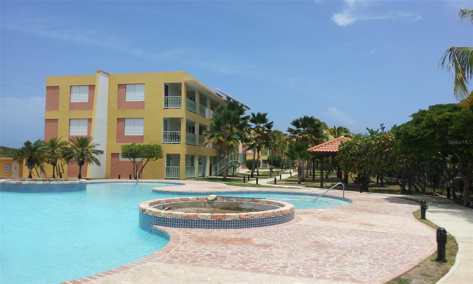Playas del Caribe Resort, located in the highly sought-after coastal town of Cabo Rojo, Puerto Rico 00623. This one-bedroom, one-bathroom beachfront unit (approx. 450 sq. ft. of gross living area) offers an unbeatable opportunity to own a piece of paradise with panoramic views of the Caribbean Sea. Situated at SR-301 Km 11.0, Boquerón Ward, this residence is positioned directly across from the beautiful Bahía Salinas, providing one of the most tranquil and picturesque beach settings on the island.
The unit features a functional layout designed for comfort and relaxation. Inside, you will find an open-concept living, dining, and kitchen area that flows naturally to the private front balcony, where the true highlight of the property awaits: uninterrupted ocean views and the sound of waves just steps away. This one-bedroom retreat is ideal for use as a primary residence, vacation getaway, or investment property.
The community of Playas del Caribe Resort enhances the lifestyle with its resort-like atmosphere and prime location. Residents and visitors can enjoy nearby natural wonders and attractions, including the Cabo Rojo Salt Flats, the Cabo Rojo Lighthouse at Los Morrillos, La Playuela Beach, El Combate Beach, Playa Sucia, Playa Pitahaya, and the vibrant beach town of Boquerón. Cabo Rojo is famous for offering over 120 beaches, each with its own unique beauty, as well as a variety of restaurants, marinas, and outdoor recreational activities. Whether you enjoy hiking through nature reserves, birdwatching, mountain biking, fishing, or simply relaxing on sandy shores, this area has something for everyone.
This property also represents a practical ownership opportunity. Monthly HOA fees are approximately $142.00, annual property taxes (CRIM) are around $1,000.00, and annual insurance costs are also approximately $1,000.00. Utilities and services are readily available, and the property is located in an area with excellent accessibility.
With its unbeatable oceanfront location, close proximity to protected natural reserves, and flexible lifestyle options, Playas del Caribe D-303 offers the rare chance to own a Caribbean retreat in Cabo Rojo’s most iconic beach corridor. Whether you envision it as a personal getaway, a rental property, or a long-term investment, this unit delivers exceptional value and long-term potential.
Coordinates for easy access: 17.9498, -67.1943.
CRIM Tax ID: 424-059-234-10-009.
Discover why so many choose Cabo Rojo as their preferred coastal destination in Puerto Rico. Playas del Caribe D-303 is more than just a property—it is your gateway to oceanfront living and the natural beauty of the Caribbean.  SALES PRICE $189,900.00