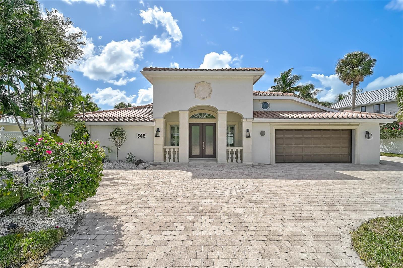 548 Siesta Drive is more than just a home—it’s a gateway to the best of Siesta Key living with unmatched flexibility, location, and waterfront luxury.

Welcome to this luxury coastal retreat on North Siesta Key, perfectly positioned inside Sarasota city limits, making it a rare short-term rental–friendly opportunity. With deep water access just seconds from the Bay, two boat lifts, and a jet ski lift, this home is tailor-made for boaters, water enthusiasts, and investors seeking a strong rental return.

Property Highlights
    •    3 bedrooms | 3.5 bathrooms | Bonus room
    •    Over 4,300 sq. ft. of living space
    •    Nearly 5,000 sq. ft. total under roof
    •    Prime North Siesta Key location in city limits
    •    Quick drive to Downtown Sarasota and Siesta Key Village
    •    Short-term rental potential in one of Sarasota’s hottest markets

Interior Features
As you step inside, you’re greeted by soaring vaulted ceilings and gleaming oversized porcelain white tile floors that set the tone for the home’s regal, modern style.
    •    Living Room: Expansive and open with dramatic volume ceilings
    •    Bonus Room: Hidden retreat above the garage ideal for a quiet office, playroom, or guest space
    •    First Suite: Convenient en suite bedroom on the main floor
    •    Primary Suite: Oversized retreat with a private screened lanai, spacious walk-in closets, and a beautifully remodeled spa-style shower
    •    Third Bedroom: Private en suite with direct access to the pool deck

The chef’s kitchen and entertaining area have been fully remodeled with high-end finishes, blending function and style for both everyday living and gatherings.

Outdoor Living
Step outside to your large lap pool with water views, framed by paver decking and multiple lounging areas. With direct boating access, two boat lifts, and a jet ski lift, the water is truly an extension of your backyard.

Key Upgrades
This home has been renovated from top to bottom, ensuring a move-in-ready experience with timeless finishes and thoughtful design details.