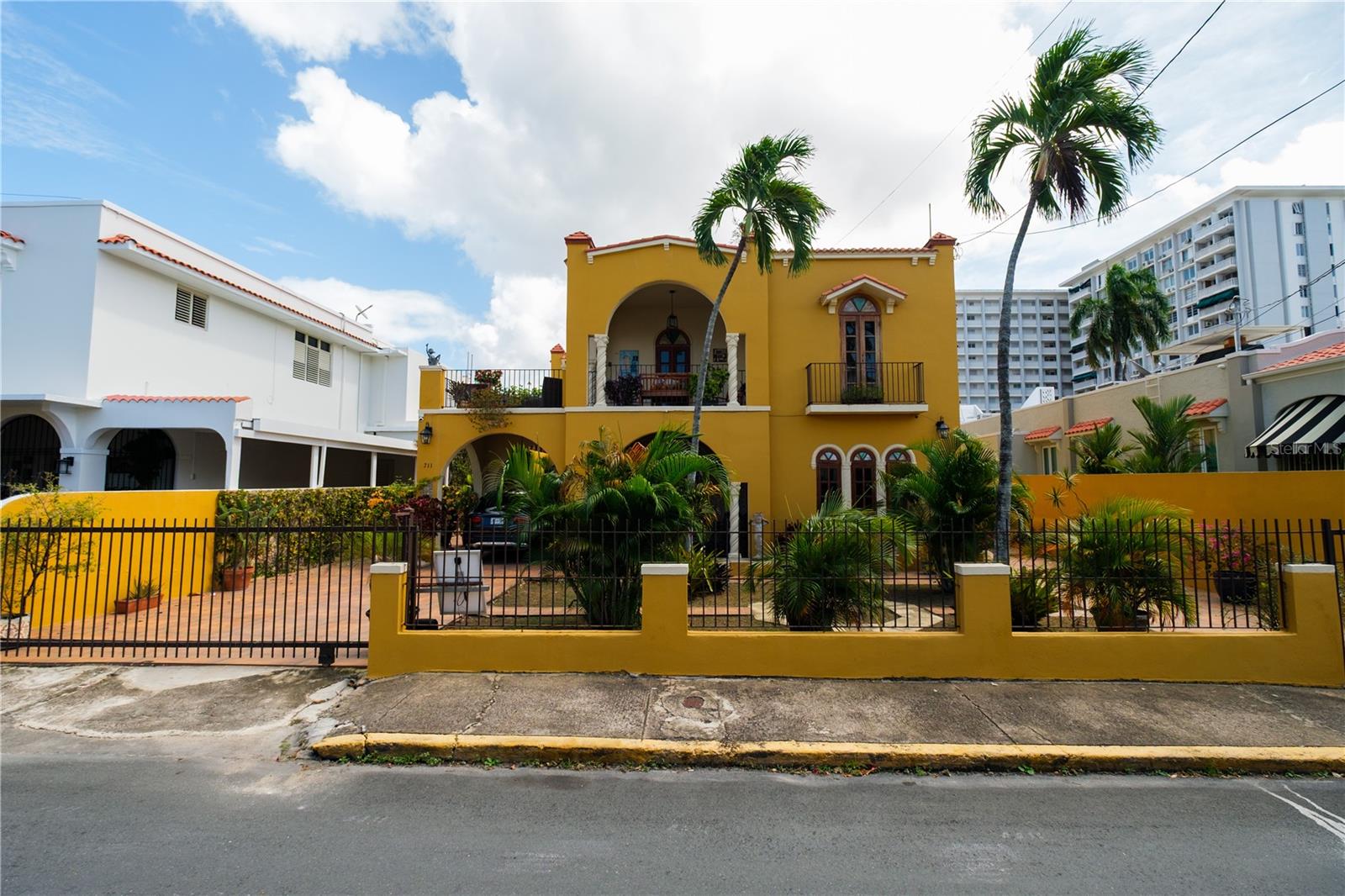 Spanish colonial-style residence in the heart of Miramar, San Juan, situated on one of the neighborhood’s most desirable residential streets. This elegant two-level property offers approximately 5,553 sq. ft. of living space, featuring eight bedrooms and five bathrooms, ideal for both a private residence or investment opportunity.

The home showcases classic architectural details, including majestic balconies, original Spanish tile floors, and three open terraces that capture the charm and breezes of this historic district. Spacious living and entertaining areas flow seamlessly to outdoor spaces, creating a warm and inviting atmosphere.

Additional features include expansive gardens, two garage areas, and two electric meters, offering flexibility for multifamily use or future subdivision. Located in Miramar’s Historic District, close to private schools, parks, restaurants, cultural venues, and minutes from Condado, Santurce, and the Convention District.

A rare opportunity to own a distinctive historic property in one of San Juan’s most sought-after neighborhoods.