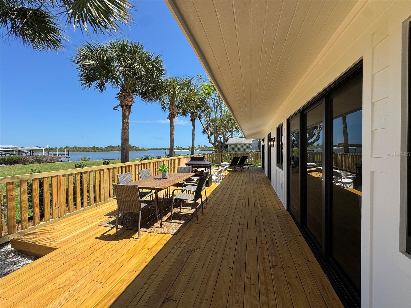 INTRACOASTAL VIEWS • OFF RIVERSIDE DR • REBUILT 2026

Quiet cul-de-sac off coveted Riverside Drive with stunning views of the Intracoastal Waterway and PUBLIC WATER ACCESS at the end of the street — perfect for kayaking, paddle boarding, and fishing. Rebuilt from the studs in 2026 by a licensed Florida general contractor (owner-builder).

Designer kitchen with black appliances and gold finishes. Collapsible sliders open to a private deck for sunsets and dolphin-watching. Two renewed bedrooms, two updated baths, tile throughout, updated electrical/plumbing/HVAC. Attached garage. NO HOA.

Golf cart or bike to New Smyrna Beach along the scenic Riverside pathway. Edgewater Public School (8/10) one mile away. Detailed renovation summary available upon request.

The rare combination: Riverside Drive location, Intracoastal views, public water access, 2026 studs-out rebuild — without the price tag of direct waterfront.

Every detail has been thoughtfully updated, creating a move-in-ready retreat that lives as beautifully as it looks. If you’ve been waiting for something truly special on the water, this is it.
