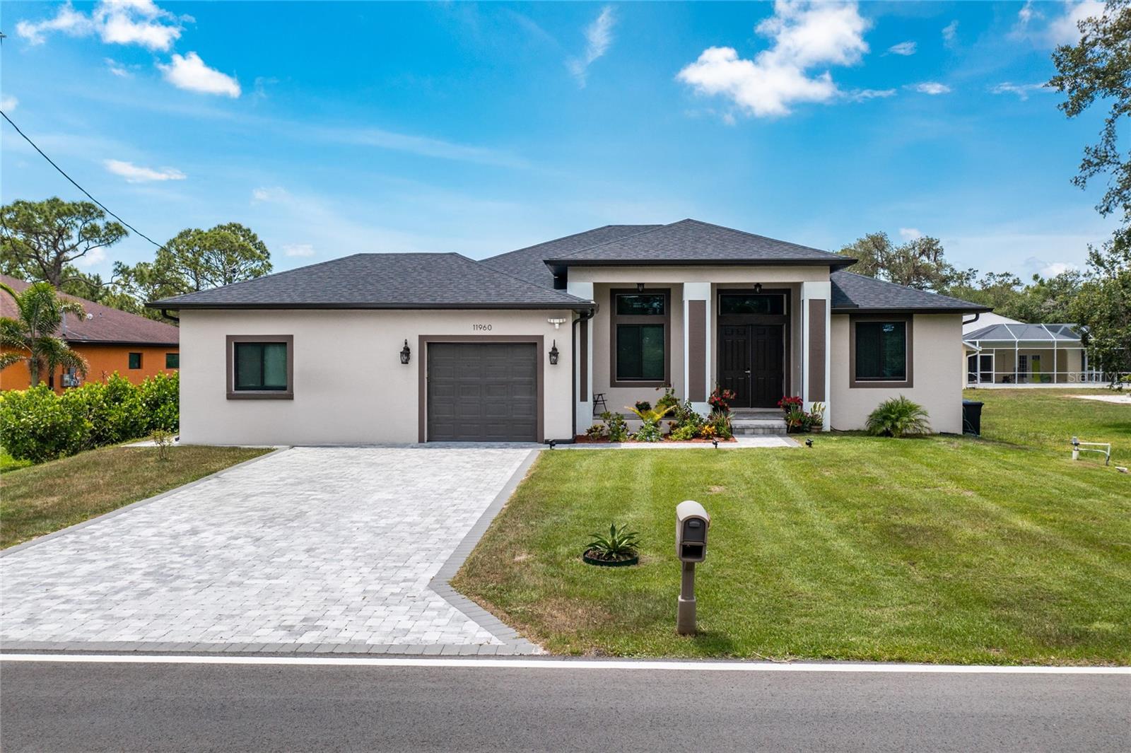 BUILT IN 2023 | MOTHER-IN-LAW SUITE | GOURMET KITCHEN | HURRICANE WINDOWS | 3-CAR GARAGE WITH BATHROOM | 3,288 TOTAL SF |
2,086 SF LIVING Welcome to this stunning 2023 custom-built home, where elevated design meets versatile living—just minutes from the healing waters of Warm Mineral Springs. From the moment you arrive, the home’s commanding curb appeal and elevated lot set the tone for what’s inside. Step into a space defined by soaring 10-foot ceilings, 8-foot interior doors, and hurricane-impact windows, creating a bright, open, and airy feel throughout. The heart of the home is the gourmet kitchen, featuring sleek LG appliances, elegant granite countertops, and abundant workspace—perfect for entertaining or everyday living. The main residence offers: 2 spacious bedrooms 2 full bathrooms Formal dining room Expansive living room The attached Mother-in-Law suite—ideal for extended family, guests, or rental income—features: 1 bedroom 1 bathroom Living area & full kitchen Private entrance Enjoy the versatility of the Florida room, upgraded with custom cabinetry and a built-in sink—an ideal retreat for work, play, or relaxation. The oversized 3-car garage includes a dedicated bathroom, providing unmatched convenience for outdoor work, hobbies, or gardening. Highlights Include: Built in 2023 Total Area: 3,288 sq ft Living Area: 2,086 sq ft 10' ceilings throughout 8' interior doors Hurricane-impact windows Gourmet kitchen with LG appliances & granite Private Mother-in-Law suite Florida room with custom built-ins 3-car garage with full bath This is more than a home—it’s a lifestyle upgrade. Don’t miss the opportunity to own a beautifully upgraded new construction in one of the most desirable areas of North Port. Schedule your private tour  today!