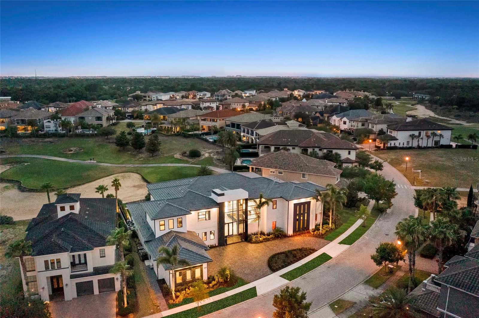 THE MAGICAL MANSION – Dreams really do come TRUE!! Welcome to Reunion Resort, and one of the most iconic properties in the world. This 9 bedroom, 13 bathroom custom built masterpiece is a playground for all ages. Located in Reunion Resort, this destination property can also be that turn-key investment property for you and your family. You won’t need a magic wand to enter this special place, but the towering glass entry will surely make you feel like your entering a magical destination. The MASSIVE open Florida floor plan is just the start of the adventure. The lounging space stretches throughout the first-floor entry, drawing you outside to the amazing 75ft long custom pool and lanai area. This home boasts one of the LARGEST POOLS in REUNION. Have your meal prepared in the custom high-end kitchen that is filled with Wolf appliances, a custom Sub-Zero fridge, and eye catching granite waterfall island. The home’s first floor continues with 2 master en-suites that are custom designed for your high-end guest experience and two private baths. The formal regal suite, also on the first floor, is the glamorous oasis that you are looking for and provides private access to the oversized outdoor living space. A private gym and a custom gaming room means there is always an opportunity to carve out some “me” time. The celebration continues on the first floor at the full-service bar area that is accented by the accordion glass window servicing cool drinks from inside to the lanai, perfect for those large party get togethers. Exploring the home reveals arguably the BEST THEMED ROOM in the world! Once you and your children experience it you will never forget it! You and your guests will be amazed to Infinity and Beyond! - The kids TWO-STORY themed room makes you feel like you are on a Pixar movie set and the size of an army man. You catch yourself looking for Buzz and Woody. A private firework show is broadcast on the ceiling while the little ones live the dream in the custom bunk beds. The entertainment and theming for this house seems to never end; “Mirror Mirror on the wall”, you say, find out if you’re the fairest one of all.. Every detail is meticulously thought out making you feel like a kid again and appreciate this one of kind creation. This property is like owning your own private theme-park. The second floor continues to amaze with four more master suites and themed bedrooms. Twelve reclining seats line a private theater room that is set up for private viewings. For others, explore the upstairs bar or oversized balcony that overlooks the pool area and the 14th hole of the Signature Jack Nicklaus golf course. This homes custom-designed pool is west facing, showcasing a 10-person spill over spa. The 70+ ft pool is lined with LED lights making the STARS always out at night. This home is sure to delight and create lasting memories you and your family will share for a lifetime. One-of-a-kind opportunity which cannot be replicated. Reunion Resort is located just 6 miles from Walt Disney World and centrally located to all the other great entertainment venues in Central Florida. **REUNION RESORT ACTIVE MEMBERSHIP AVAILABLE** Come for a weekend or stay for a lifetime..