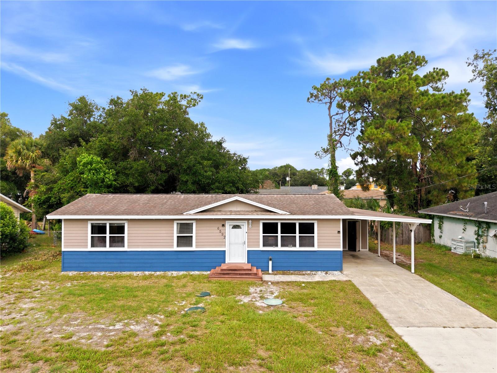 Welcome home to 6592 Emil Ave. This 3 bedroom 3 bath NO HOA home is an ideal first or forever home. 

Sitting on nearly a quarter acre, you'll enjoy a spacious Florida backyard great for entertaining, gardening or hanging out. When you enter from the side carport, you land in the large family room that can be utilized as a bonus space or play area. The pass through to the kitchen allows everyone to stay connected. Through the french doors, you enter the dinette which sits near the kitchen and breakfast bar. Stone counters, updated appliances, ceramic tile and two additional pass throughs on the opposite side to the kitchen to the living room keep everyone together while offering a dedicated cooking space to prepare your favorite meal. 

The living room, situated at the front of the home, is an ideal size for cozy relaxing, without feeling stuffy, while the family room in the back offers plenty of space for gym equipment, a movie room setup or something you imagine. Additional mini splits in the primary bedroom and the family room help keep energy costs and the temperature low. Through the back door of the Family room, you can exit to your large outdoor screened patio seating area, your outdoor oasis. Continuing through a second screen door, you find your outdoor patio deck where you can catch some sun, or check on the grill or smoker overlooking the fire pit in your spacious backyard. A separate outdoor storage room and covered carport is connected to the home via the roof.

The three bedrooms and living areas offer water proof, SPC Core Luxury Vinyl Plank flooring and ceiling fans. The Primary bedroom has a walk in closet for your wardrobe and another bedroom offers dual closets for plenty of storage space. 

Two of the bathrooms connect the primary and second bedroom together, Jack and Jill style, great for a growing family or those that need to stick close together. Smart Home features include select lighting and thermostat controls via your personal device. 

** Some upgrades include; Roof 2019, Water Heater 2022, AC 2024, Septic tank and Drain field 2022, Septic Pump 2026, LVP flooring 2024. **

Drive times: Orlando International Airport 35min, Cocoa Beach 35 min, Port Canaveral 24 min, Kennedy Space Center, 10 min. Downtown Orlando and Disney both less than 1 hour.

** Seller is offering a $5,000 credit toward Buyer's Closing Costs. ** Schedule your showing today.