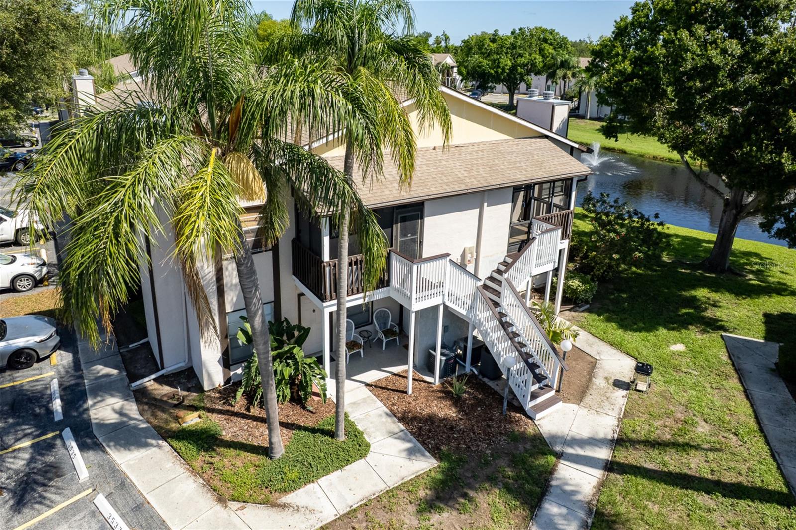 Discover your perfect retreat in this beautifully appointed second-floor condominium featuring lake views,  vaulted ceilings and thoughtful upgrades throughout. The welcoming living room,seamlessly flows into the dining area and kitchen. The master bedroom boasts a generous walk-in closet with ample storage and private en-suite bathroom. Additional conveniences are a second full bathroom with linen/storage closet, private in-unit washer and dryer in dedicated utility closet, and an expansive screened front lanai with room for seating and additional storage. Located in the sought-after Mirror Lake community, you'll enjoy the ideal balance of tranquil living and convenient access to everything Southwest Florida has to offer. Minutes from IMG Academy, a short drive to pristine Anna Maria Island beaches and surrounded by premium shopping, dining, and entertainment. The Mirror Lake community is completing a comprehensive exterior renovation featuring fresh paint, updated stairs, and enhanced screened lanais - adding both beauty and value to your investment. The HOA fee covers, Community recreation and maintenance, cable TV, sewer, and trash collection - simplifying your monthly expenses and maximizing your value.  A sparkling community pool, fully equipped fitness center,  professional tennis courts and children's playground all await you at this pet friendly community.