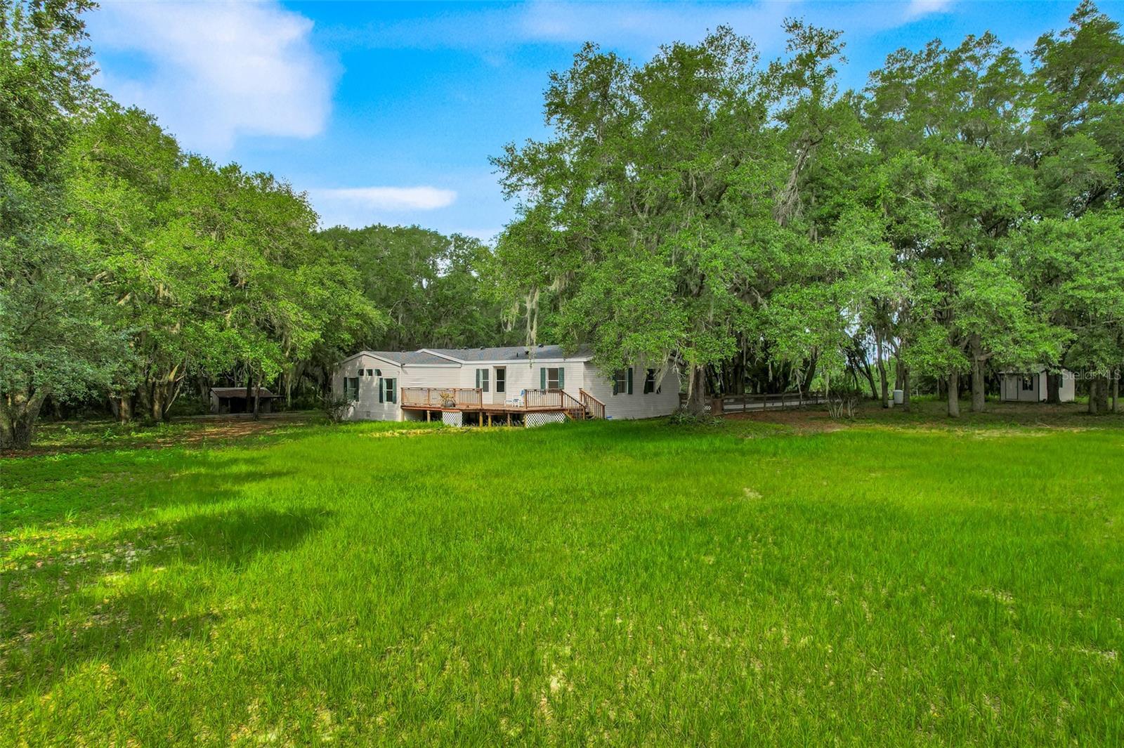Nestled at the end of a private road on 10 expansive agriculturally zoned acres, this stunning home offers rare
privacy and endless possibilities. Surrounded by peaceful countryside, the property is an ideal setting for
horses, livestock, or hobby farming, with plenty of room to roam and room to grow. Whether you dream of
riding trails, raising animals, gardening, or simply escaping to nature, this land delivers. The long private
driveway leads directly to the home, ensuring maximum seclusion while remaining conveniently located. If you
crave wide-open spaces, true privacy, and the freedom of country living with a touch of adventure, this is the
property you've been waiting for. This is a wonderful home for raising your family!