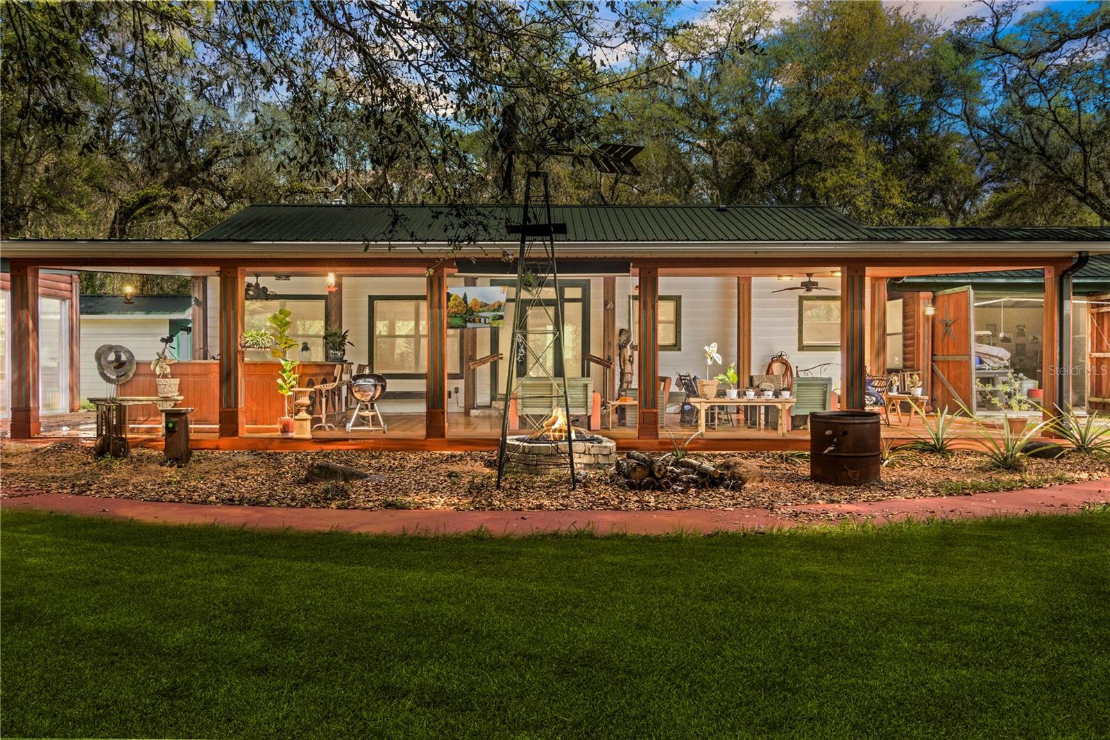 One or more photo(s) has been virtually staged. Don’t miss your once in a lifetime opportunity to own this stunning 10 acre Ranch-style estate in the heart of Webster. The open floor plan interior features marble tile and natural wood accents throughout. The thoughtfully designed kitchen is a chef's dream, featuring newer Stainless Steel Appliances, custom cabinetry with soft-close doors and drawers, and a mobile center island. Venture outside and watch the sunset from the oversized front lanai featuring a full-sized outdoor bar with 2 refrigerators and ample seating. Spend the evenings relaxing in your enclosed jacuzzi room. The oversized garage with 4 automatic doors creates ample workspace and is perfect for all vehicles including tractors and farm equipment. If you are looking for the true Ranch lifestyle experience, this property is perfect for you. The grounds feature a custom-built chicken coop, multiple livestock feeding and watering stations, as well as multiple pole barns. Wild game such as Deer and Turkey are also abundant and seen frequently. There are simply too many features to list, please ask your agent for the Feature Sheet attached in the MLS. The property is in an ideal central location, 45 Minutes to Orlando, Tampa, and Ocala. 35 Minutes to The Villages and West Coast Beaches. High Speed Spectrum Internet now available.