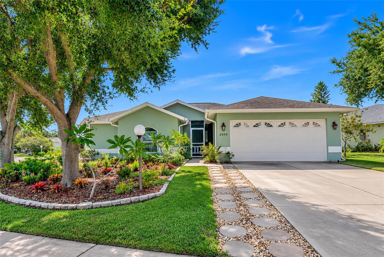 Welcome home to this fantastic property nestled in a quiet community. As you arrive, you'll immediately appreciate the oversized two-car garage and the gorgeous, tree-filled lot offering plenty of shade, privacy, and exceptional curb appeal.
Inside, this inviting 4 bedroom, 2 bathroom home features comfortable living spaces designed for both everyday living and effortless entertaining. High ceilings, abundant natural light, and tasteful tile and laminate flooring throughout create a bright and welcoming atmosphere. At the heart of the home, the well-appointed kitchen offers matching appliances, a cozy breakfast bar, and ample cabinetry to accommodate all your culinary needs.
The spacious primary suite serves as the perfect retreat, complete with a beautifully updated en-suite bathroom featuring a relaxing walk-in shower and a generous walk-in closet. Three additional bedrooms provide plenty of space for family and guests or can easily be adapted into a home office, hobby room, or fitness area.
Step outside to the charming screened-in patio, the ideal spot to enjoy your morning coffee, unwind with a glass of wine, or gather with family and friends for an al fresco meal. Beyond the patio, the expansive fenced backyard is shaded by mature trees, including fruit trees, creating a secluded oasis with endless possibilities for gardening, entertaining, recreation, or simply relaxing.
Located in the peaceful community of Paddocks Central, this home also offers the added benefits of low HOA dues and minimal restrictions, giving you the flexibility to truly make it your own. Combining comfort, charm, and convenience, this exceptional property is ready to welcome its next owners. Whether you're searching for your first home or your forever home, this is one you won't want to miss. Schedule your private showing today before it is gone!