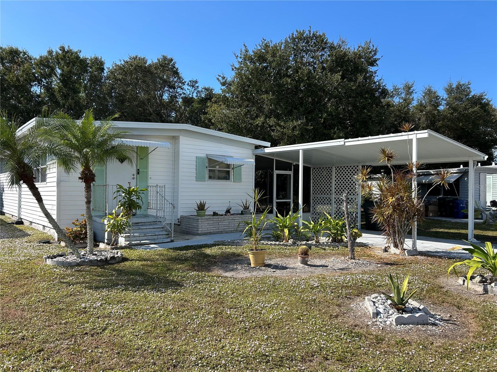 Location, Location, Location - Tri Par Estates, in the pet allowed area & out of the flood zone(code X zone) also no home is behind this property! 2 large bedrooms, 2 bathrooms, large Florida room & screened in room! Everything is included except personel items! Tri-Par Estates is a 55+ community in which you own your home and the land. A park fee of $1,648.00 a year is part of the property taxes paid once a year, includes Frontier internet, cable also trash. There is a large pool, hot tub, mini golf, laundry facilities, fitness room, clubhouse, and many activities to enjoy. Just minutes to the airport and many other necessities nearby like hospitals, shopping, restaurants and more. Airplanes & jets do fly over Tri Par Estates(navigation easement). Tri Par is a state park & recreation development.