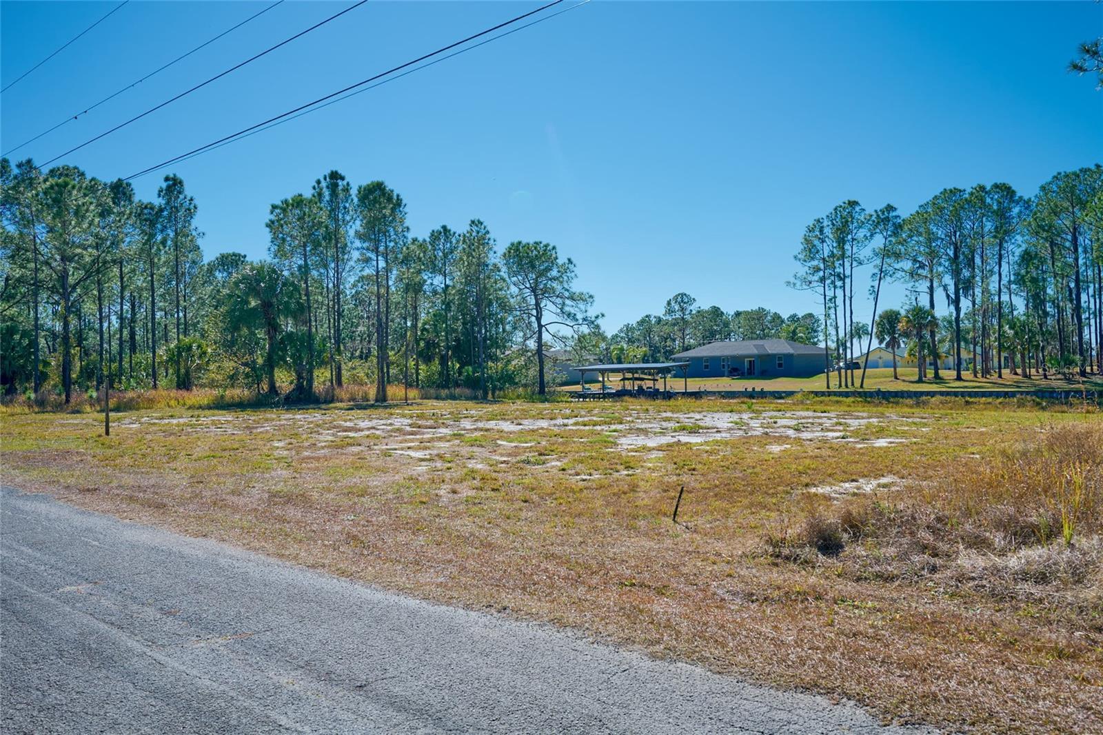 Each parcel in Indian Lake Estates is unique and deserves its own description. CALLING ALL BUILDERS! This lot has been cleared and building can start quickly. This CANAL LOT has been cleared and is ready for your dream construction and personalized landscaping. Facing East, the front of your home takes in the sunrises and the back of your home faces nightly sunsets, each one better than the last. The parcel is almost square, so you have 145 feet of water frontage and 150 feet of depth from the road to the canal. So build a wide, ranch-style home or a narrow contemporary style home. There’s plenty of room for porches and pools to enjoy the Florida weather. This is the second canal away from the largest lake in Polk County, Lake Weohyakapka, so you are a short boat ride away from fishing and water sports – or you can fish right from your back yard. The roads are private, so drive your golf cart to the clubhouse for a round of golf, or to eat at the clubhouse or bakery right here in the neighborhood, or to the lake to watch the sunset from over the water. As you begin to plan your future in Florida, consider living a nice, private life in this neighborhood of Indian Lake Estates (informally, ILE). And, when you feel like socializing, the active community offers concerts, karaoke and trivia nights, card games, bingo, bunco, golf scrambles, movie nights, a book club, plus basketball, pickleball and tennis courts, just to name a few. Indian Lake Estates is a perfect balance of privacy and activity. Take a drive out to ILE and start to draw up your dream home on this blank slate!