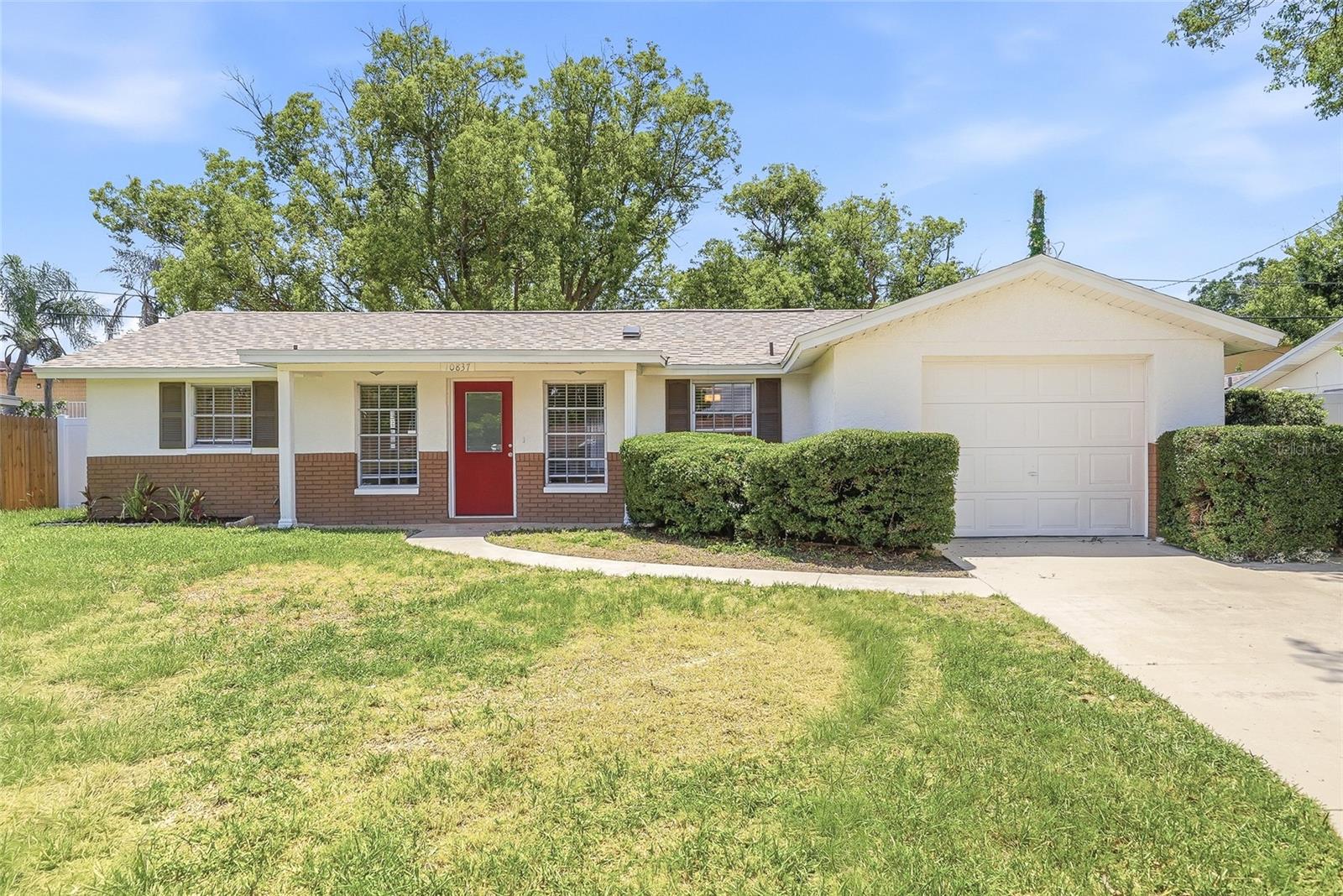 Welcome to this completely move-in ready 2-bedroom, 2-bathroom home with a versatile bonus room in the heart of Port Richey, offering modern upgrades, flexible living space, and the added benefit of no HOA or CDD fees. From the moment you arrive, you'll appreciate the fresh exterior paint, refinished driveway, spacious two-car parking pad, and attached one-car garage, providing ample room for vehicles, recreational equipment, and additional storage. Inside, bright and inviting living spaces feature brand-new flooring, recessed lighting, fresh interior paint, and contemporary finishes throughout. The updated kitchen is equipped with all-new appliances, creating a functional and stylish space for everyday living and entertaining. Major improvements have already been completed, including a NEW ROOF (2026), NEW HVAC SYSTEM (2026), NEW WATER HEATER (2026), and NEW FENCING (2026), offering peace of mind for years to come. The bonus room adds valuable flexibility and can easily serve as a home office, media room, playroom, guest space, or potential third bedroom. Step outside to the fully fenced backyard, offering privacy and plenty of room for pets, outdoor gatherings, gardening, or simply enjoying Florida's beautiful weather. Conveniently located east of US-19 in Flood Zone X500, this home is just minutes from shopping, dining, medical facilities, parks, beaches, and everyday conveniences. Thoughtfully updated throughout and ready for its next owner, this property offers an exceptional opportunity to enjoy the Florida lifestyle with comfort, convenience, and no additional community fees.