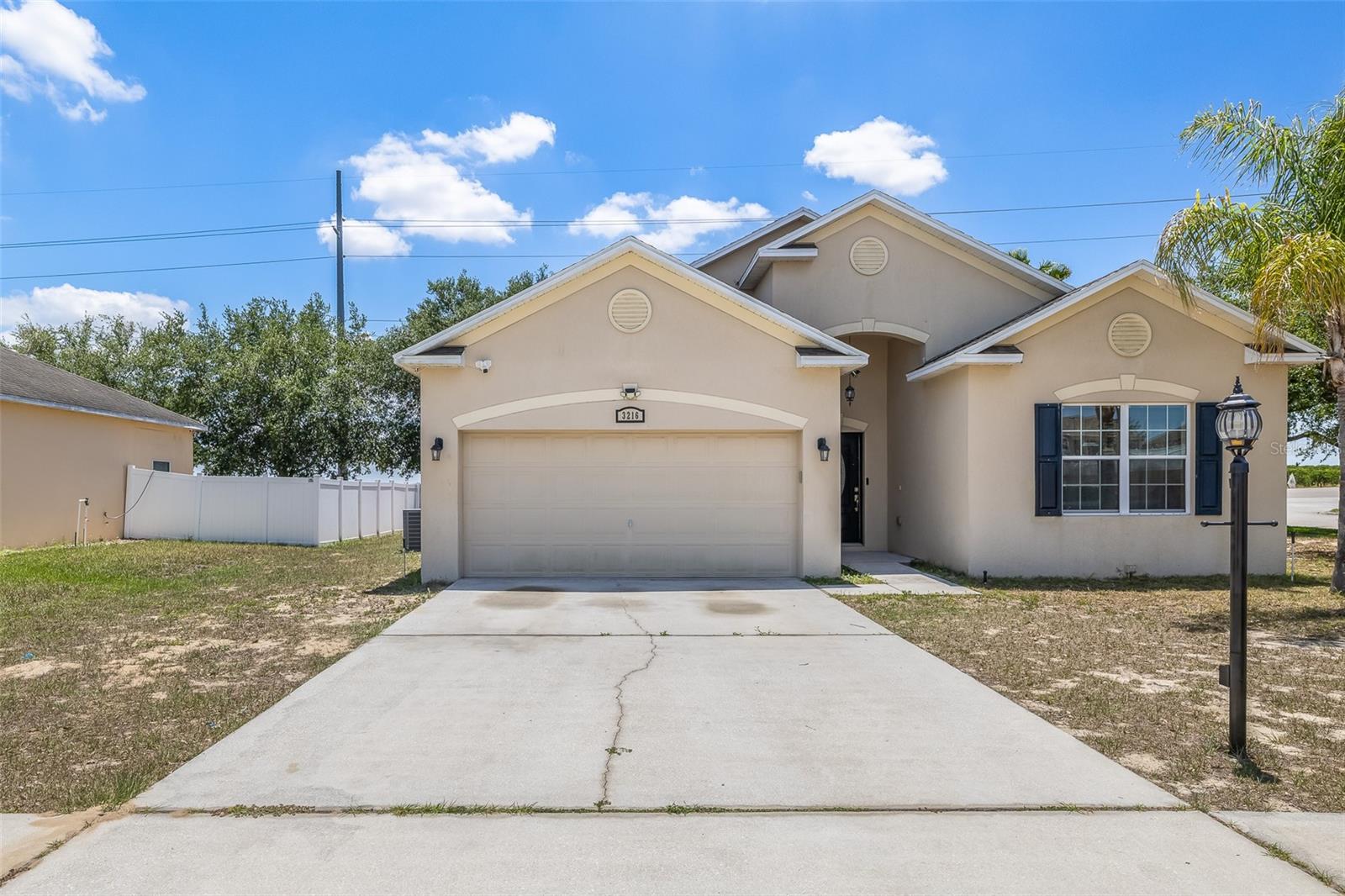 BACK ON MARKET. Welcome to this stunning. tranquil corner-lot home! This well-kept 4-bedroom, 2-bath property with a 2-car garage, offers 1,855 sq. ft. of comfortable living space designed for both everyday living and entertaining. As you enter, you’ll immediately notice the open layout connecting the living room, dining area, and kitchen—giving you a spacious feel . The kitchen features a convenient breakfast bar, with updated ceiling fans throughout the home adding a nice modern touch. The primary suite offers a private retreat with its own en-suite bathroom, complete with a soaking tub and separate shower—perfect for relaxing after a rough day. Step outside to a large screened lanai, ideal for year-round entertaining or just hanging out. Situated on a corner lot near the Lake Eva Community Park,Idealy situated from nearby shopping, dining, and major attractions like Disney and Tampa. This is your opportunity to own this beautiful home in Dundee, Florida