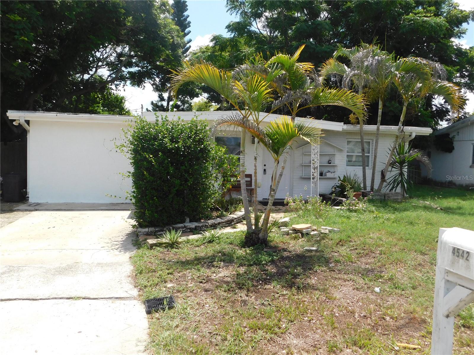 Great Opportunity! With a little TLC, this could be the perfect first home, retirement retreat, or investment property. This 3BR/2BA home offers flexible living space, including a bonus room ideal for a 4th bedroom, office, or den. Features include an open floor plan, split bedrooms, a spacious primary suite with an updated bath, newer roof, maintained A/C, and a large fenced backyard.  Conveniently located near shopping, restaurants, entertainment, Sam's Club, schools, and downtown New Port Richey. No HOA. No CDD. Motivated seller will consider buyer concessions.  Bring your vision and unlock this home's full potential—schedule your showing today! Seller will be putting a new roof on prior to closing.