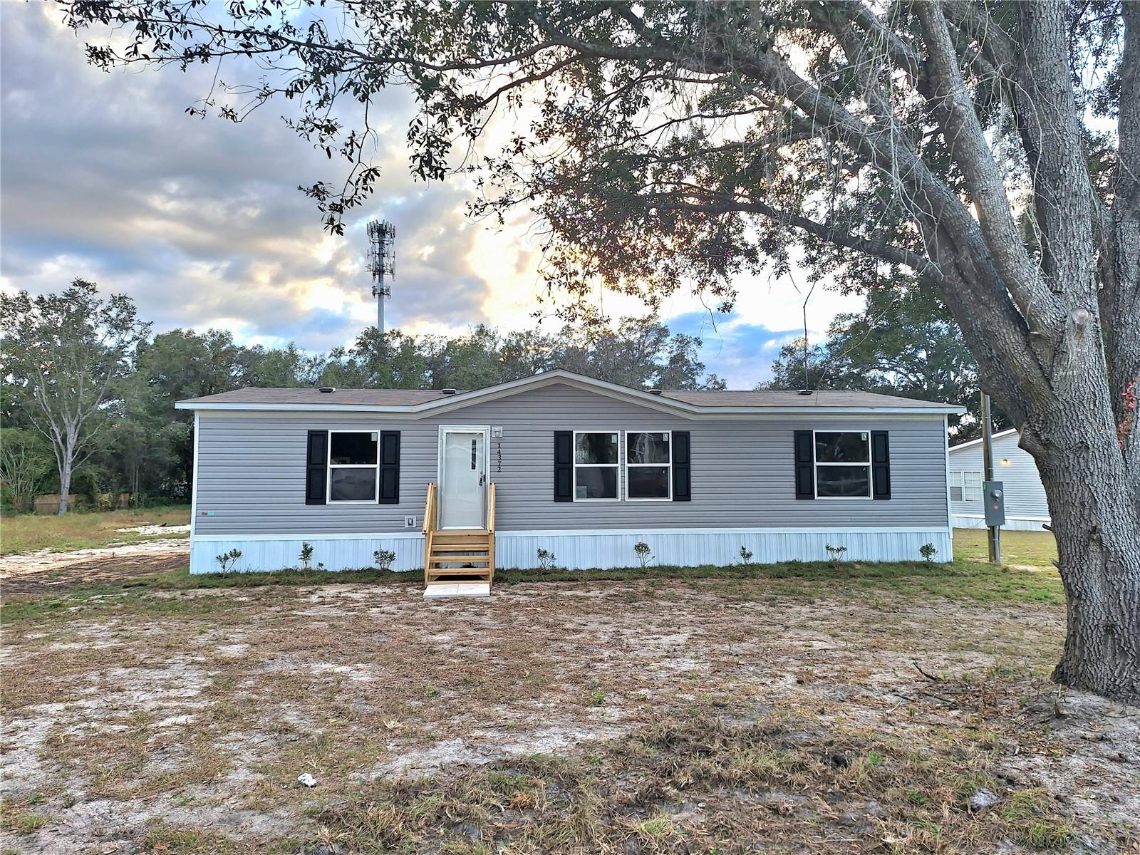 One or more photo(s) has been virtually staged. New Double Mobile Home 3 Bed and 2 bath. This property sits on 0.61 acre in Summerfield. Close to The Villages, 8 minutes from Walmart, Home Depot, BJ's, Restaurant and shopping centers and just minutes to Lake Weir. No HOA and you own the land. NEW SEPTIC. Great Location. Located right off of main highway 441.