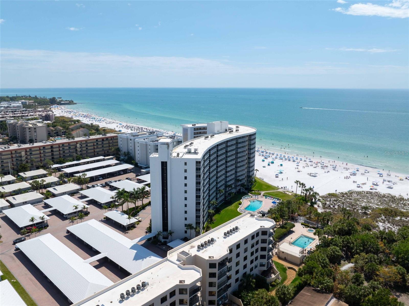 Rising gracefully along the shores of Siesta Key, Crystal Sands is one of the island’s most recognizable Gulf-front landmarks, celebrated for its soft architectural curves and commanding 12-story presence at the water’s edge. This7th-floor, two-bedroom, two-bath residence in desirable Stack 8 captures sweeping northwest views and unforgettable sunsets stretching across the horizon. Inside, the open-concept living and dining areas flow seamlessly toward expansive Gulf views, creating a light-filled retreat that feels both relaxed and welcoming. A comfortable blend of style and practicality, appreciate the low-maintenance tile floors flowing through the main living and kitchen areas and the sustainable bamboo floors adding warmth to both bedrooms. The kitchen features handsome wood cabinetry, granite countertops, stainless steel appliances, and updated lighting. A thoughtfully designed peninsula extension provides additional prep space and bar-height seating—ideal for a pre-beach breakfast, casual dining & entertaining, or gathering to revisit the day’s adventures. Move right in as this home is offered turnkey furnished, showcasing comfortable rattan accents and whimsical coastal décor that perfectly complement its beachfront setting. Ownership at Crystal Sands is refreshingly effortless, supported by an experienced on-site rental management team that handles everything from bookings and guest coordination to housekeeping and turnovers. A 14-night minimum rental policy helps maintain an elevated atmosphere and consistent clientele, offering strong income potential without the transient feel of shorter-term communities. Crystal Sands offers direct beach access to Siesta Key’s world-renowned quartz sand along with resort-style amenities and strong rental appeal. Whether envisioned as a personal beachfront getaway or an income-producing investment, this 7th-floor residence delivers comfort, views, and the unmistakable charm of Gulf-front living on one of Florida’s most celebrated beaches.