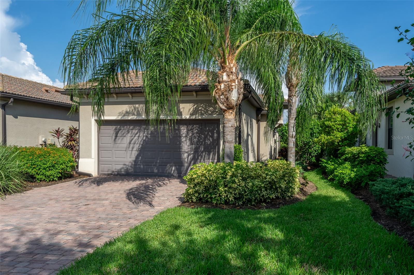 Paradise Awaits: Resort-Style Living in Palmer Ranch!

Move in today and wake up in Paradise tomorrow!  This stunning 2-bedroom, 2-full bath, with bonus room paired villa in the gated community of Hammock Preserve offers the ultimate Florida lifestyle, free from maintenance fees and CDD burdens. Imagine coffee on your screened lanai, overlooking the serene lake view while the sun rises streaming through the 8-foot doors and sliders, creating a bright and airy haven.
This meticulously maintained home boasts porcelain tile throughout, a neutral color palette, designer lighting for a modern feel, and a gorgeous gourmet kitchen with stainless steel appliances, quartz countertops, and marble backsplash.  The bonus room with a closet-ready niche provides extra space and flexibility to fit your lifestyle priorities. Peace of mind upgrades include whole-house water filtration system, infrared HVAC filters for cleaner air,  2-car garage with Epoxy flooring and Hurricane-ready with Impact entry door and whole- house hurricane shutters for the windows.
The Hammock Preserve gated community includes a Catering Club House for unforgettable gatherings, Pickleball and Tennis courts for friendly competition, sparkling resort-style pool and spa for relaxation and recreation, Fitness Center, Dog Park for your furry friend and on-site Property Manager for your convenience. Located in the heart of Sarasota County, with easy access to Downtown Sarasota cultural centers, the quaint Downtown Venice center, Siesta Key Beach and the 20-mile Legacy Trail for biking/walking while experiencing the lush tropical Florida landscaping.
Ready to trade in your worries for paradise?  This move-in ready 2017-built home is waiting for you!
