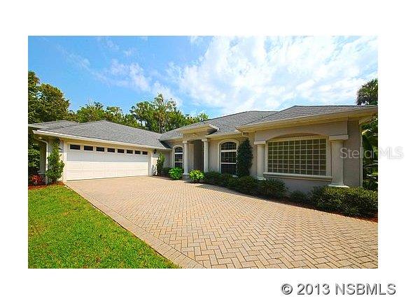 A MUST SEE! Lovely executive, custom built home on Lake Waterford. Gated community. Private, pavered driveway up to this beautiful residence. Open floor plan with an excellent view of the private pool and lake. Private, lighted dock. 12' ceilings in the living room and 10' throughout the remainder of the home. Built-ins throughout. Formal living room and den/office area. Kitchen is open to be able to view the lake with breakfast nook with window seating. Stainless steel appliances (Kitchen Aid, tile back splash with granite counter tops. Large Master suite consists of a Jacuzzi tub, shower, his and her closets and sinks. Master bedroom has three large windows to take in the views. Wood, carpet and tile throughout. Living room has tray ceilings and crown molding throughout the home. Separate washer and dryer area with wash tub and pantry. Surround sound throughout. Jack and Jill bathroom to connect the second and third bedrooms. Split plan. Pool bath. Pool is self cleaning, with three fountains and chlorinated. 3' to 5' deep. Solar equipment available, if buyer wanted to connect it. Covered lanai area off kitchen and living room. Pest tubes throughout home, treated monthly. All blinds included in sale. New A/C installed 10/2013. Detached Workshop - 16x12 and 10x12 Utility Shed.  Over sized two car garage and pull down attic. Lots of mature landscaping to keep your home very private. Community boat ramp, tennis court, and clubhouse. The lake is great for fishing, skiing/wake boarding and boating. 1.2 +/- cleared vacant lot available for purchase too, which would provide close to 3 acres on Lake Waterford ;Water: City