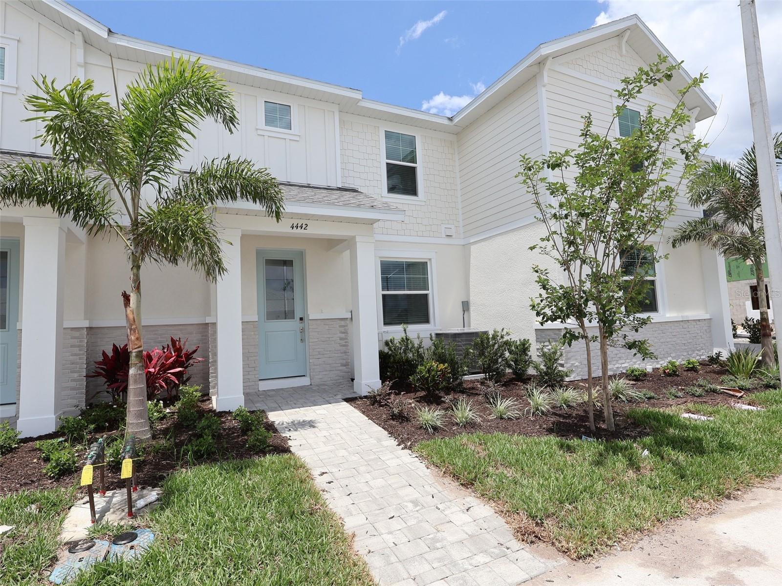****SPECIAL FINANCING AVAILABLE FOR A LIMITED TIME ONLY FROM PREFERRED LENDER. RESTRICTIONS APPLY, FOR QUALIFIED BUYERS, SUBJECT TO APPLICABLE TERMS AND CONDITIONS. SUBJECT TO CHANGE WITHOUT NOTICE****
Welcome to the Carmel. This gorgeous townhome includes 1,702 square feet of living space with 3 bedrooms, 2.5 bathrooms, and a rear-load, 2-car garage.
Enter the foyer and be greeted by the dreamy kitchen overlooking the rest of the home. The kitchen features plenty of counterspace, stainless steel appliances, and a spacious island, great for early morning breakfast or unwinding after a long day.
Ahead is the open dining room for gatherings. The great room, laundry room, and powder room sit off to the side. An oversized great room will comfortably host your loved ones, while the outdoor lanai is just steps away. Outside the Carmel is a tranquil courtyard with room for chairs or a dining set to enjoy the Florida weather and access to the 2-car garage.
On the second floor, the spacious owner’s suite is found at the top of the staircase with a large walk-in closet, beautiful windows for cascading sunshine, and the relaxing owner’s bath.
The second and third bedroom await farther down the hallway. Turns these into side-by-side rooms or utilize one bedroom as an office or guest room. You’ll also find a second full bath upstairs right next to the bedrooms for easy access.