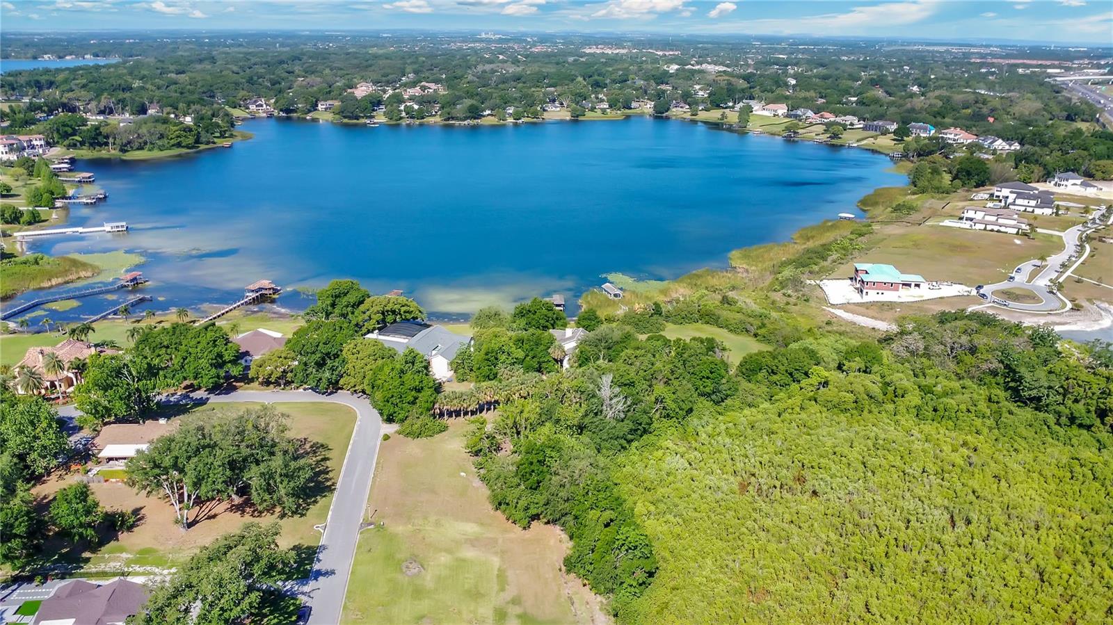 Location, Location, Location!! Windermere Lot: 2.62 acres, with 1 acre buildable, for an incredible luxury designer estate with partial water views of Lake Olivia and a stream. NO HOA REQUIRED! Bring your custom builder. When you see this land, you will admire the beauty of nature. Gorgeous conservation views and spacious areas between the homes in the community. Nestled in the heart of Central Florida, the city of Windermere, FL, is a charming lakeside town boasting a rich history, luxurious real estate, and an exceptional quality of life. With easy access to Orlando's world-famous attractions, Windermere, Florida, offers the perfect balance between serene lakeside living and vibrant city life. Top-rated schools, fine dining, shopping, world-class golf, theme parks, and quick access to major expressways. Roberts Landing in Windermere, FL, is located on the east shore of Lake Olivia. The main entrance is on Westover Roberts Road across from Westover Club and Westover Reserve, two other Windermere, FL, communities. The streets here are winding and well-shaded, like most mature Windermere communities. Lake Olivia in north Windermere, FL, is a private lake. This rare lot in Windermere is an incredible opportunity. Build the luxury estate of your dreams.