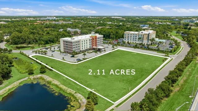 2.11-acre commercial development and investment opportunity in the heart of the Lakewood Ranch/University Town Center (UTC) corridor, one of Southwest Florida's premier growth markets. Zoned PD-MU (Planned Development-Mixed Use) according to the Manatee County Property Appraiser, this highly visible site offers exceptional access to Town Center Parkway, University Parkway, and Interstate 75 (Exit 213). Positioned adjacent to Hyatt Place (122 rooms), Home2 Suites by Hilton (108 rooms), and Fairfield Inn & Suites by Marriott (87 rooms), the property benefits from approximately 317 hotel rooms on Exchange Way alone, with more than 940 hotel rooms within approximately three miles. Recent reports indicate five additional hotels are planned within Lakewood Ranch, including three along the nearby Town Center Parkway corridor, reinforcing the area's continued commercial expansion and increasing overnight visitor demand. According to Seller, all major utilities have been stubbed to the site. Buyer shall independently verify utility availability, capacity, and connection requirements. Located minutes from UTC, reporting 20M+ annual visitors and more than $1B in annual retail sales, the property is surrounded by major attractions, healthcare, dining, and ongoing residential and commercial development. According to RCLCO's 2025 rankings, Lakewood Ranch ranked the #2 top-selling master-planned community in the U.S. and remains among the nation's fastest-growing multigenerational communities. Illustrative marketing materials present "The Exchange," a conceptual vision only and do not represent approved plans, entitlements, permitted uses, or future development. Buyer shall independently verify zoning, permitted uses, development standards, utilities, environmental conditions, access, traffic counts, impact fees, and all information material to Buyer's intended use.