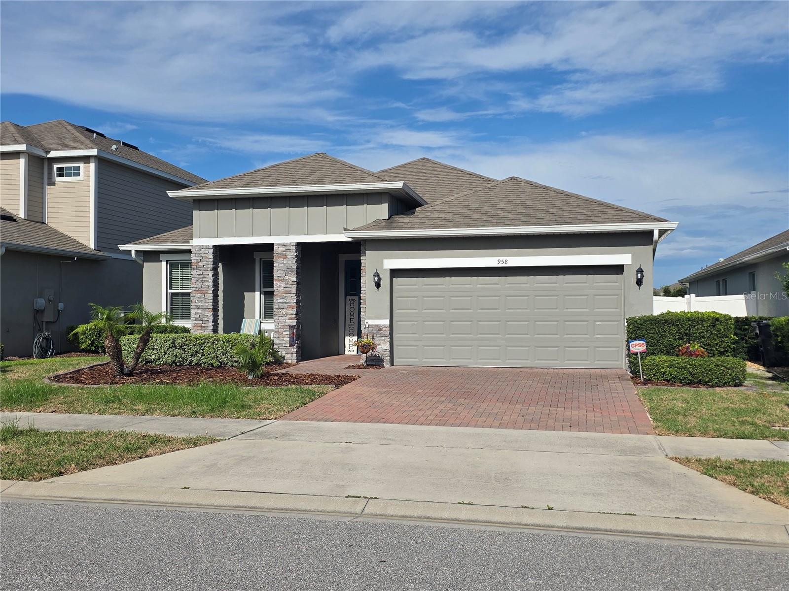 Former Park Square model home featuring upgraded finishes throughout. Interior features include wood plank style ceramic tile flooring, stainless steel appliances, granite countertops, a mosaic backsplash, and 42-inch pewter cabinetry. The primary suite includes dual closets, and each room is finished with window treatments and blinds.

This home offers an enclosed porch overlooking a fenced backyard and pond view with amazing sunrise views. Orange City location with access to area trails, lakes, boat docks, parks, outlet shopping malls, an array of dining options, beaches, the Amtrak Auto Train, SunRail, and major roadways.
Ready for its next owner. Schedule a showing!