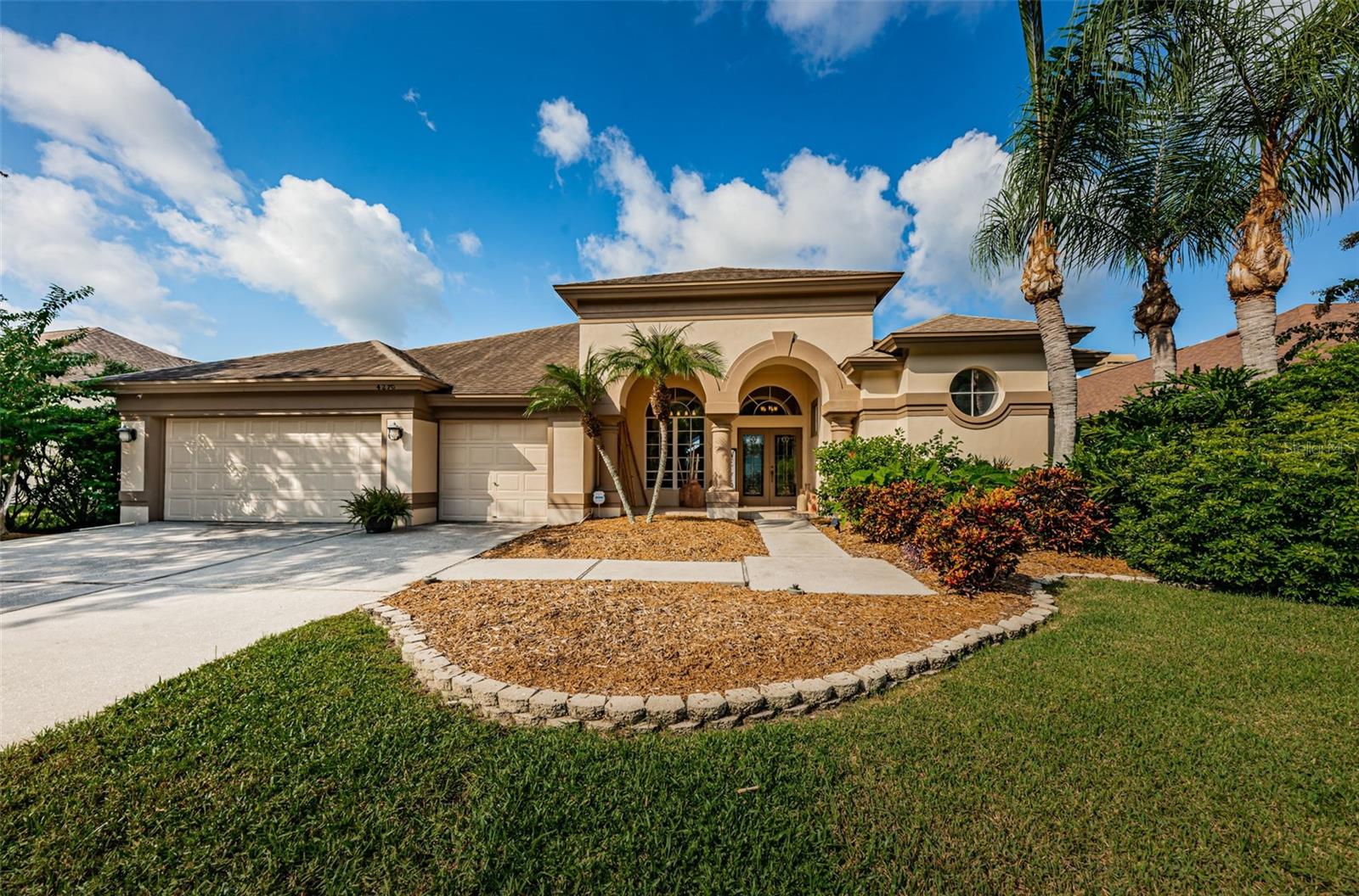 This lovely 4 bedroom/3 bath home is located in Aylesford, one of Lansbrook’s most desirable subdivisions. The split bedroom layout includes a formal living room/dining room, gourmet style kitchen, and a family room. The Island kitchen is equipped with loads of features including: a large breakfast bar, as well as a window front dinette area. The Family Room features a wood burning fire place, volume ceilings, and an abundance of natural lighting. The home has numerous glass doors that lead out to the screen enclosed lanai pool deck area. The garage offers lots of storage space for vehicles as well as recreational toys. The Lansbrook community offers numerous amenities, such as: a Public Golf Course, a YMCA, a Recreation park with volleyball/basketball courts, as well as a boat ramp park with direct access to Lake Tarpon. This is one of those homes with too many features to list, you really must see it for yourself. Please click on the virtual tour link for additional photos