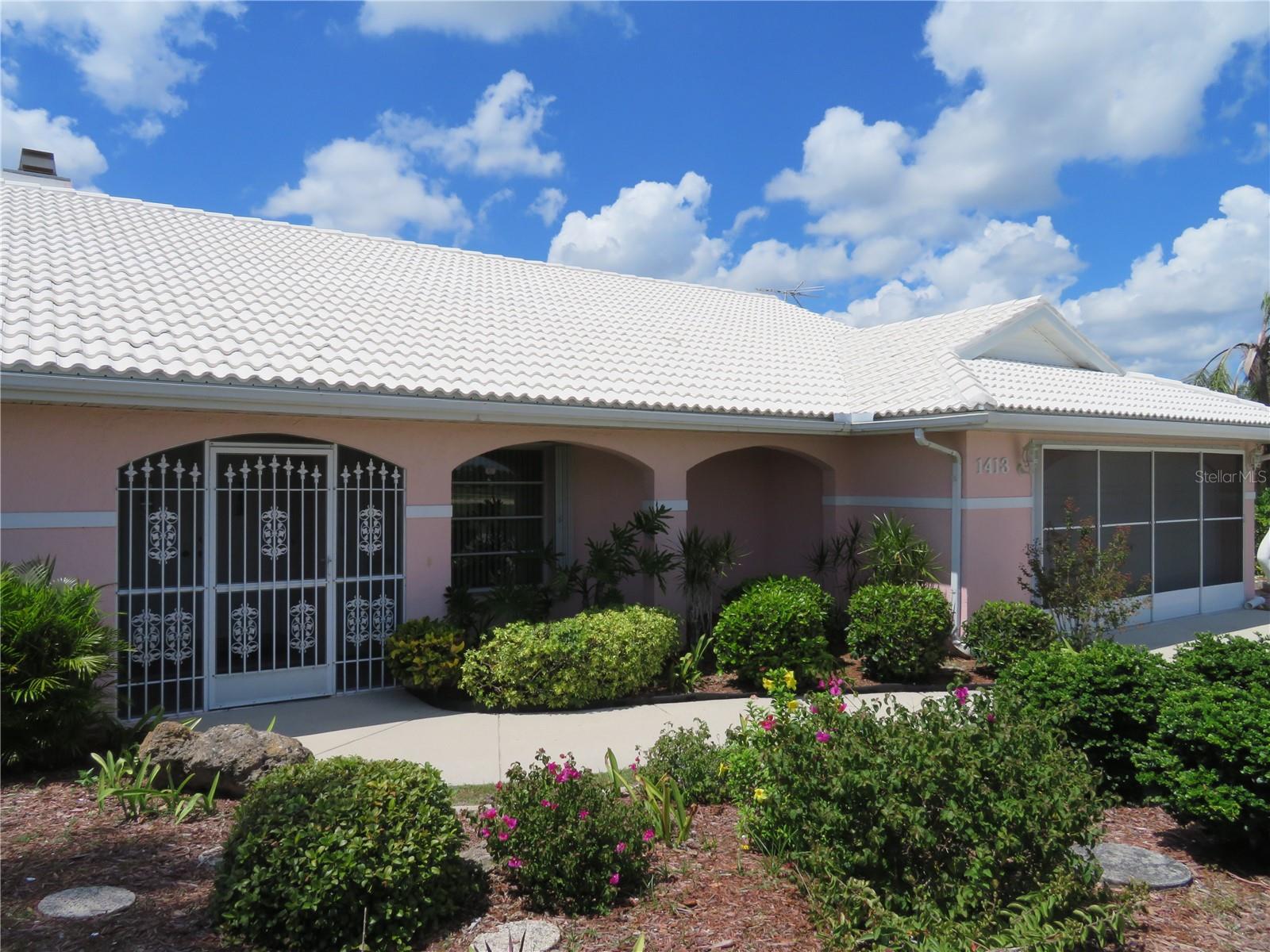 This One Owner, Original Builder's Model, has been Lovingly Cared for! Embrace the Unique Features like the Stone Fireplace in the Greatroom, a Convenient Wash Tub in Laundry Room, a Useful Foyer Closet, Tile Roof and More. The Spacious Open Floor Plan Boasts a Breakfast Nook with 3 Large Windows overlooking the Lanai/Pool Area, a Huge Greatroom with a 12 ft Slider out to the Lanai/Pool Area, with adjacent Dining Area for Entertaining and an Open Kitchen with 2 Pantries, a Skylight and a Breakfast Bar. The 28 ft Lanai is Absolutely the Best Place to Relax with a Tranquil View of the Glistening Pool and Beautifully Landscaped Backyard! with Convenient Access to the 2nd Bathroom. This Amazing Area is fully Enclosed, and Under Air, with 4 sets of Sliders including a Spectacular 16 ft four panel slider, anchored by two 9 ft triple panel Sliders and an 8 ft Dbl Slider on the end. This is a Must See! You'll have Peace of Mind with Locking Accordion Shutters all Around!  And Enjoy the Surrounding Beauty of the Lush Landscaping Yearround!  Located in Deed Restricted Deep Creek with a Community Playground, Basketball Courts, Tennis/PickleBall, semi-public Golf Course and nearby Public Boat Ramp, Fishing, Golfing, Shopping, Restaurants and Beautiful Gulf Beaches! Access to I-75 and US 41 within a short distance. Schedule Your Showing Today!