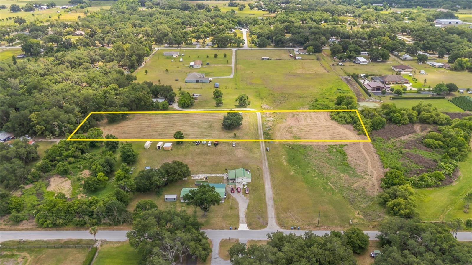 FEEL THE COUNTRY CALLING? Rare opportunity to own 3.07 acres in desirable Plant City with AS-1 Agricultural Single-Family zoning and NO HOA. This beautiful rectangular parcel offers approximately 200 feet of frontage and, according to prior listing information, the soil previously supported strawberries, squash, and other crops, making this an excellent option for a future homestead, mini-farm, horses, livestock, or country retreat.
The property features a peaceful rural setting surrounded by large acreage homesites, pastureland, and open countryside while still providing convenient access to I-4, Tampa, Lakeland, and Plant City shopping and dining. Single-family or mobile homes are allowed, and the property is located in a non-deed restricted area, giving flexibility for future use.
Access is provided via a 30-foot perpetual easement on Farm Acres Way. Flood Zone X means the property is outside the Special Flood Hazard Area according to available records. The land is mostly cleared with scattered mature trees and wide-open pasture views throughout the surrounding area.
Seller states potential Hillsborough County impact/mobility fee credits may be available. Buyer to verify existence, amount, transferability, eligible fee categories, expiration, and applicability to buyer’s intended use directly with Hillsborough County.
Whether you are looking to build your dream home, establish a private retreat, create a small farm, or invest in acreage in one of Plant City’s growing rural corridors, this property offers exceptional potential and versatility.