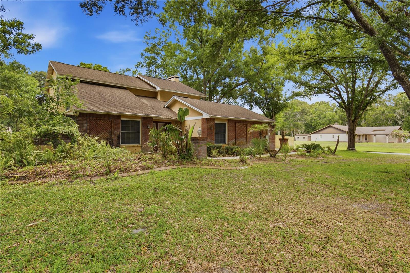 Rare opportunity to own a beautiful home situated on a sprawling 1.75-acre corner lot in one of Land O' Lakes' established neighborhoods! Offering the perfect blend of privacy, space, and convenience, this property provides plenty of room to spread out while remaining close to shopping, dining, schools, and major roadways.

Step outside and enjoy your own private Florida oasis featuring a screened-in swimming pool, perfect for relaxing, entertaining guests, or enjoying year-round outdoor living. The expansive lot offers endless possibilities for gardening, recreation, additional parking, or future enhancements.

Inside, you'll find a welcoming floor plan with comfortable living spaces designed for everyday living and entertaining. Whether you're looking for room to grow, a peaceful retreat, or a property with plenty of outdoor space, this home delivers exceptional value and endless potential.

Properties offering nearly two acres, a corner lot, and a screened pool in an established neighborhood are hard to find. Don't miss your chance to make this exceptional Land O' Lakes property your next home!