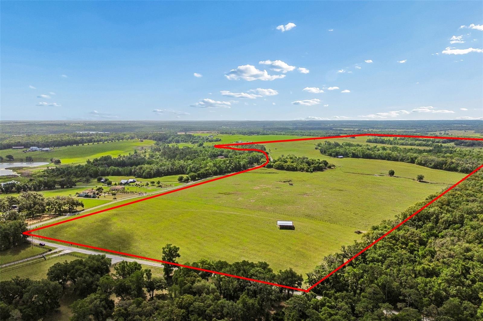 Discover the potential and peaceful setting of this expansive 90-acre property on Johnston Rd. Offering a blend of natural beauty and usable land, this property presents an ideal canvas for a custom home, multigenerational living, or agricultural use.

Opportunities like this are becoming increasingly limited, especially in areas that provide both privacy and convenience. With agricultural zoning in place, the property is well-suited for livestock, horses, or those simply seeking space and a slower pace of life.

Currently not subdivided, this property offers the opportunity to divide in the future, creating added value and flexibility for multiple homesites or long-term investment potential.

Ideally located just minutes from I-75, you’ll enjoy easy access to surrounding areas while maintaining a quiet, rural atmosphere. Only 20 minutes to Wesley Chapel, 30 minutes to Tampa, and just 15 minutes from charming downtown Dade City, where you’ll find local dining, shopping, and small-town charm.