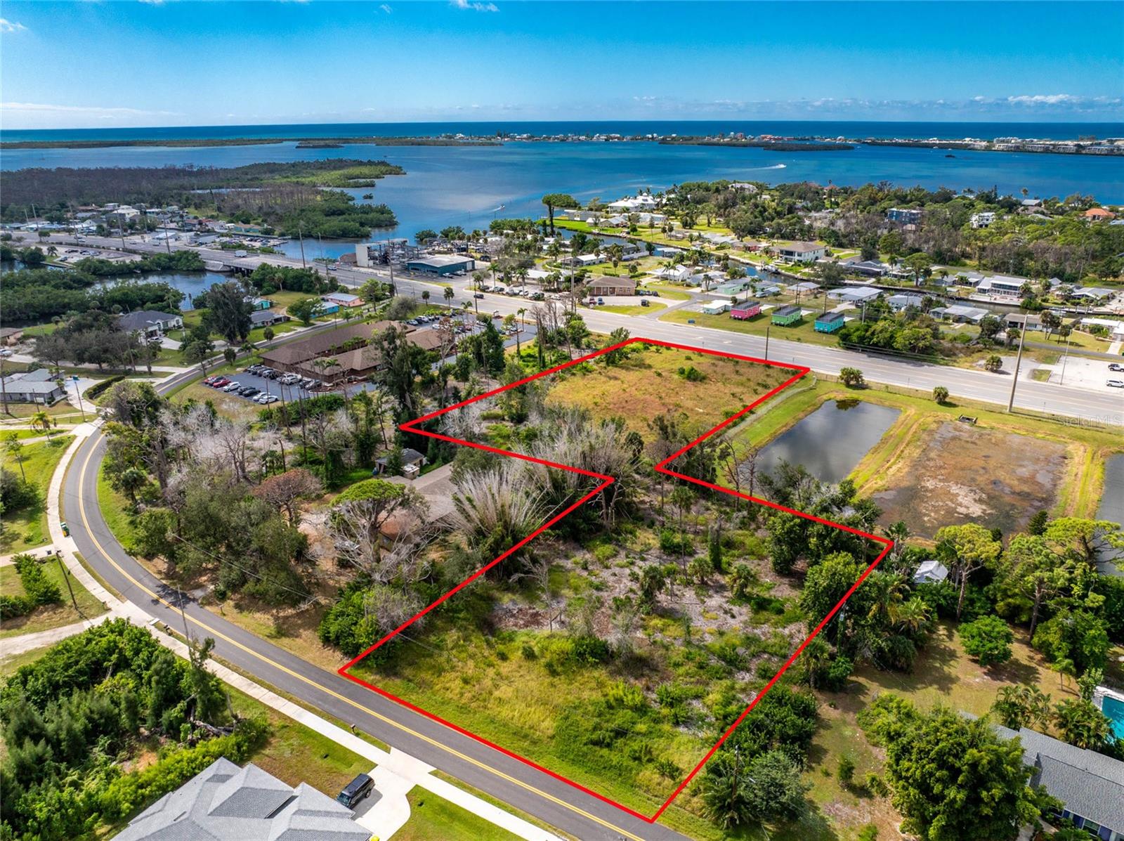 Prime opportunity along Placida Road offering two adjoining parcels in a highly visible and well-traveled Englewood location. 1701 Placida Road includes approximately 1.20 acres and is zoned OMI, providing flexible options for professional, medical or institutional use. The second parcel, 1630 Manor Road, offers approximately 0.80 acres and is zoned RSF3.5 and is included in this combined sale. Both parcels create an attractive investment for future development, business expansion or long-term holding in a steadily growing area. The properties are positioned on the main road that connects Englewood, Cape Haze and Boca Grande, placing future development in a strong traffic and visibility zone with nearby residential communities, commercial centers, medical providers and daily lifestyle conveniences. An additional OMI parcel directly to the south is also available for purchase separately (Parcel ID: 412005351009), offering further potential for a larger project or strategic expansion.