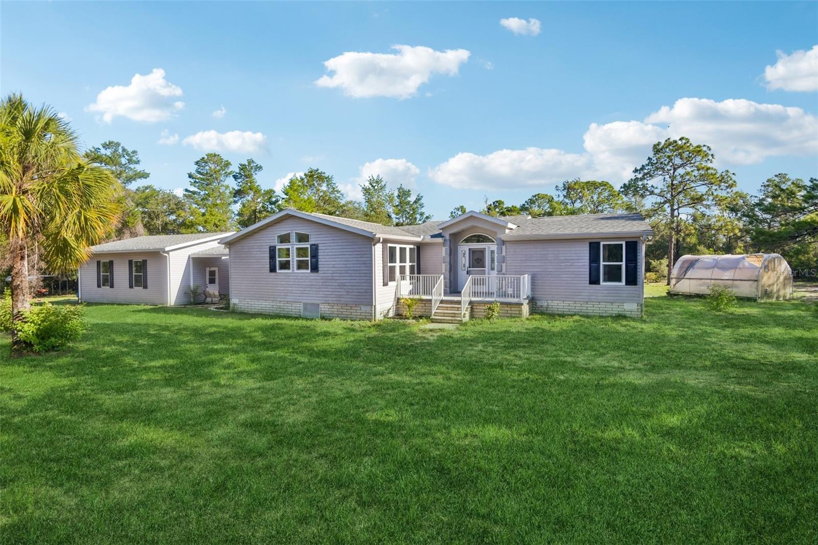 Nestled away on almost 5 picturesque acres in Brooksville, Florida, this beautifully renovated 3-bedroom, 2-bathroom home offers just over 2,000 square feet of living space with the perfect blend of privacy, comfort, and convenience. 

Inside, nearly every detail has been thoughtfully updated to create a move-in-ready home. Brand-new luxury vinyl plank flooring and carpet flow throughout the home, complemented by fresh interior paint, new windows, modern light fixtures, and ceiling fans. The stunning kitchen has been completely redesigned with new cabinetry, granite countertops, backsplash, and a full suite of new appliances, including a gas range, making it the perfect space for cooking and entertaining. Both bathrooms have been tastefully modernized with new cabinetry, countertops and fixtures, while the spacious primary suite features a relaxing garden tub for a true spa-like retreat.

Outside, The covered and screened patio offers views of beautiful mature oak trees that provide shade, character, and a serene setting. An oversized two-car garage offers plenty of room for vehicles, storage, or a workshop, while the whole-home Generac generator provides added peace of mind year-round. Whether you're looking for room to spread out, space for outdoor activities, or simply a quiet place to call home, this exceptional Brooksville property delivers the best of Florida country living without sacrificing convenience.

Ideally located just minutes from Sunshine Grove Road, Cortez Boulevard, and the Suncoast Parkway, you'll enjoy peaceful country living with easy access to shopping, dining, medical facilities, and a quick commute to Tampa and all the Nature Coast has to offer.