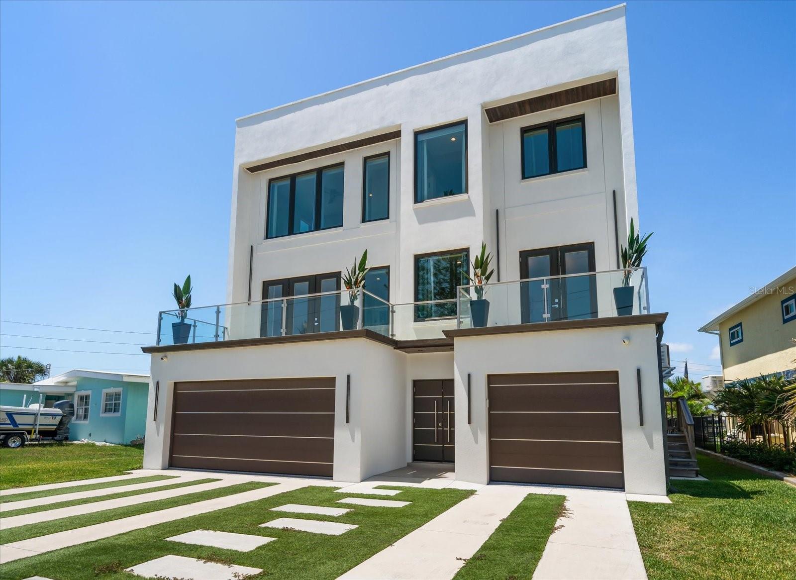 One or more photo(s) has been virtually staged. New Construction Waterfront Masterpiece in the heart of Redington Beach. A dream home for boaters and beach lovers alike, this stunning 2022-built modern European-style 4 bedroom, 4.5 bathroom waterfront residence offers the ultimate in luxury coastal living. Spanning over 5,500 total sq. ft. (including 3,202 sq. ft. of living space), this three-story, all-block construction home is built with the finest materials and move-in ready. Step inside to soaring ceilings, abundant natural light, and sleek finishes throughout. The chef’s kitchen is a showstopper, featuring top-of-the-line stainless steel appliances, Miele built-in coffee maker, quartz countertops, wine fridge, and a massive island ideal for entertaining. Flowing seamlessly into open-plan living and dining areas, this home is designed for effortless indoor-outdoor living with custom motorized blinds, hurricane-impact windows and doors, and a covered outdoor patio. Enjoy two luxurious primary suites with spa-style bathrooms, oversized rain showers, soaking tubs, and walk-in closets. Two additional guest suites on the third floor offer breathtaking views and private en-suite bathrooms.
Additional features include your own private elevator plus
• Oversized epoxy 2+1 car garage
• 400amp whole-house generator
• Two variable-speed A/C units for zoned comfort
• Private beach access with intracoastal and Gulf access
• Plenty of space for your future custom-designed pool. Plans available 
Located in the heart of Redington Beach, just steps from residents-only private beach access, local shops, and dining. This is a rare opportunity to own a slice of paradise built to newest storm protection standards—don’t miss your chance to experience luxury waterfront living at its finest. 
Schedule your private showing today!