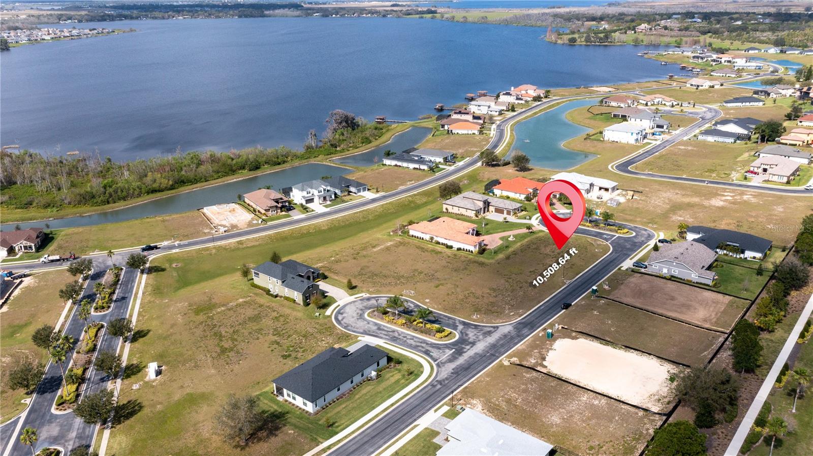 Build the home you have always dreamed of in the gated community of Water Ridge. This premium corner lot is surrounded by stunning lakes, peaceful views, and luxury residences. Enjoy resort style living with access to a clubhouse, pool, fitness center, tennis courts, private boat ramp, and fishing pier. Perfectly situated between Orlando and Tampa, offering tranquility without sacrificing convenience. An exceptional opportunity to create your ideal lifestyle in a one of a kind community. Qualified buyers may take advantage of construction financing programs offered through the seller’s preferred lender, suitable for both primary homes and investment opportunities, subject to lender terms and approval.